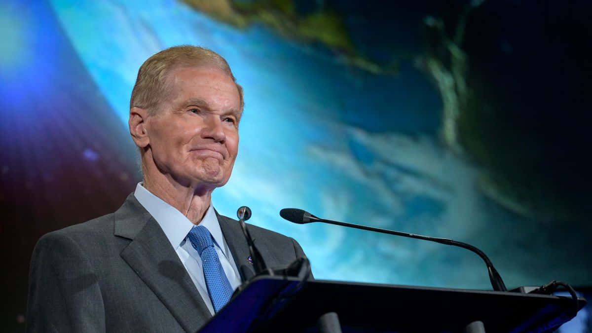 Bill Nelson With The Backdrop Of A Planet Wallpaper