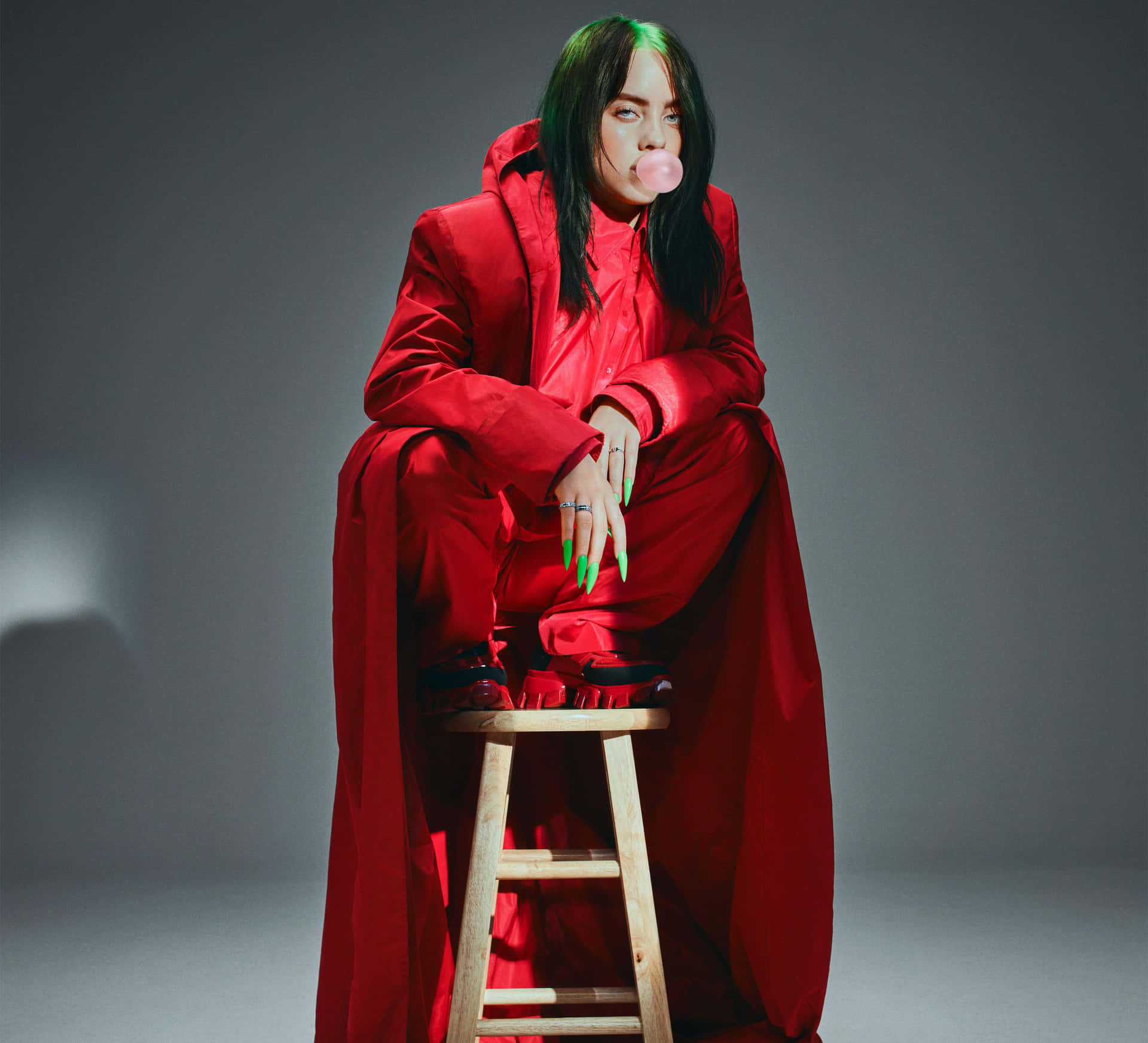 Billie Eilish looks flawless donning a denim jacket and highlighter green hair