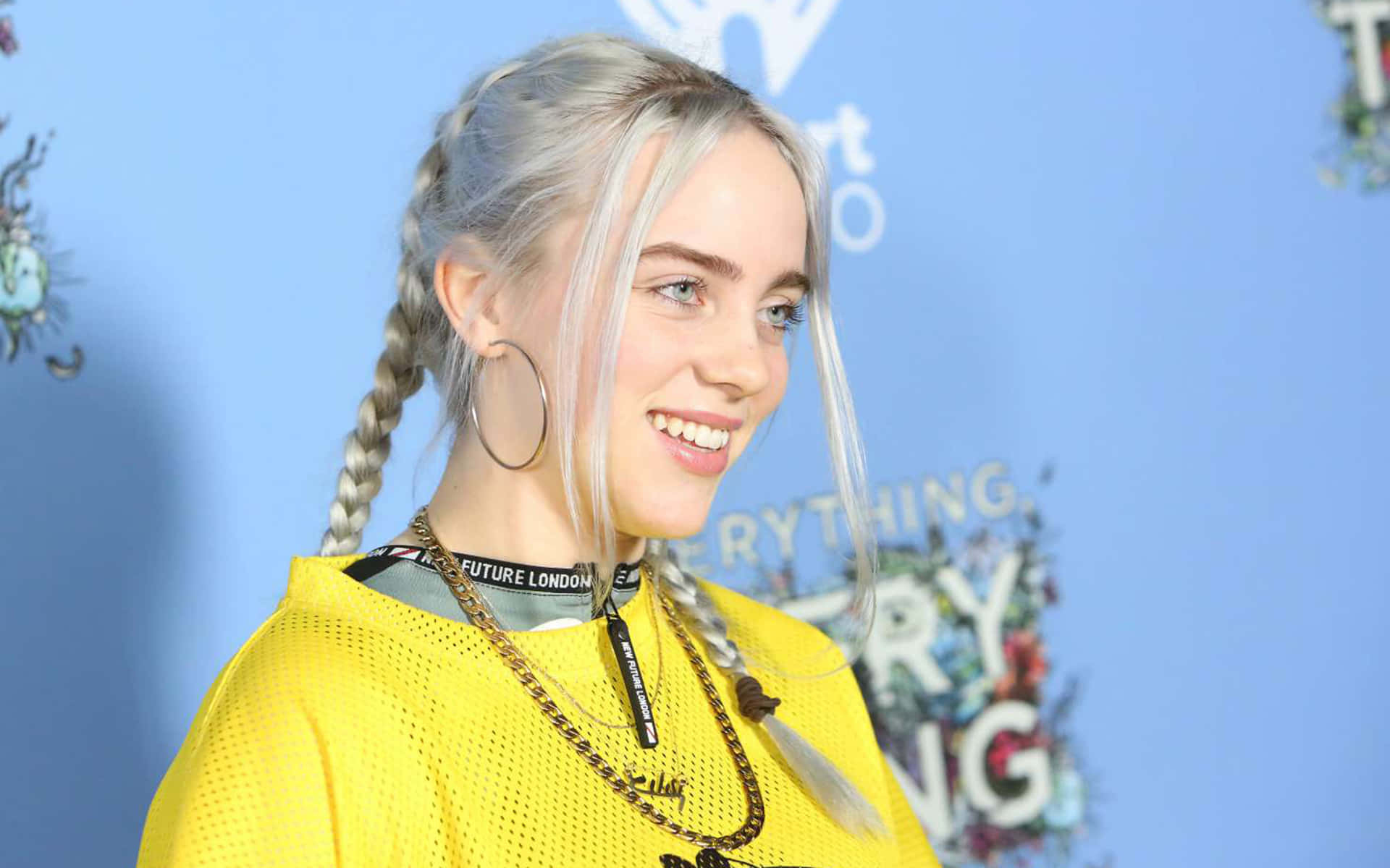 Billie Eilish photographed in front of a breathtaking beach sunset