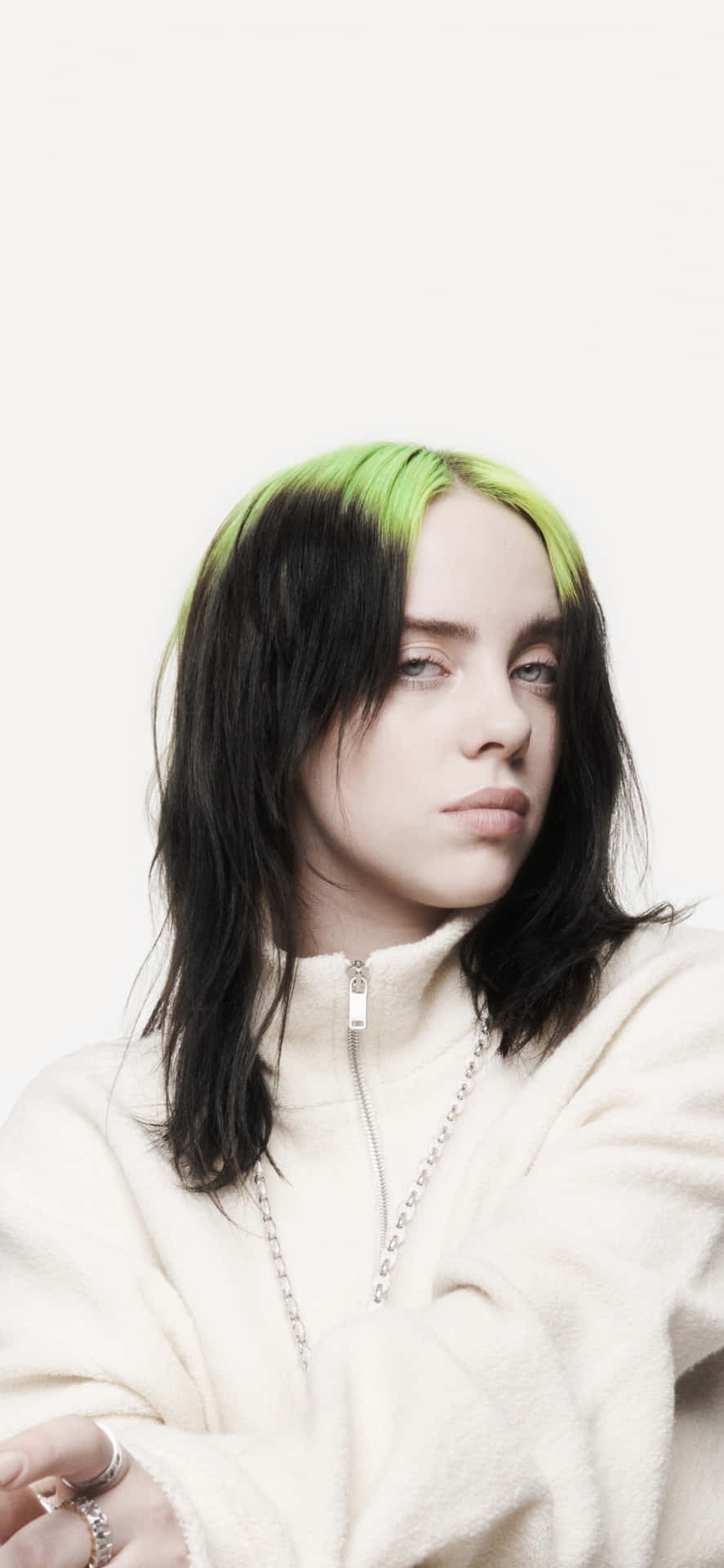 Billie Eilish on stage, showing off her unique style