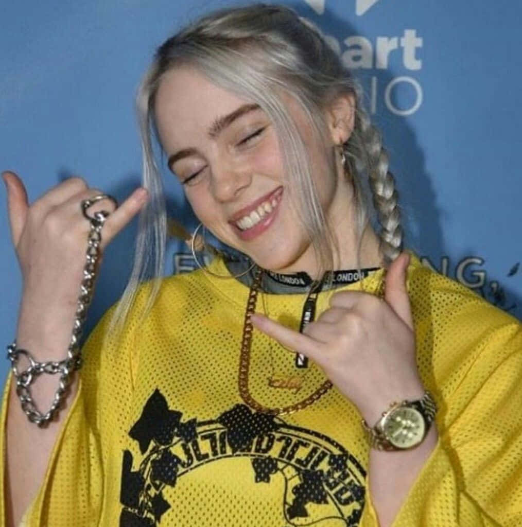 Image  Billie Eilish showing her signature toothy smile Wallpaper