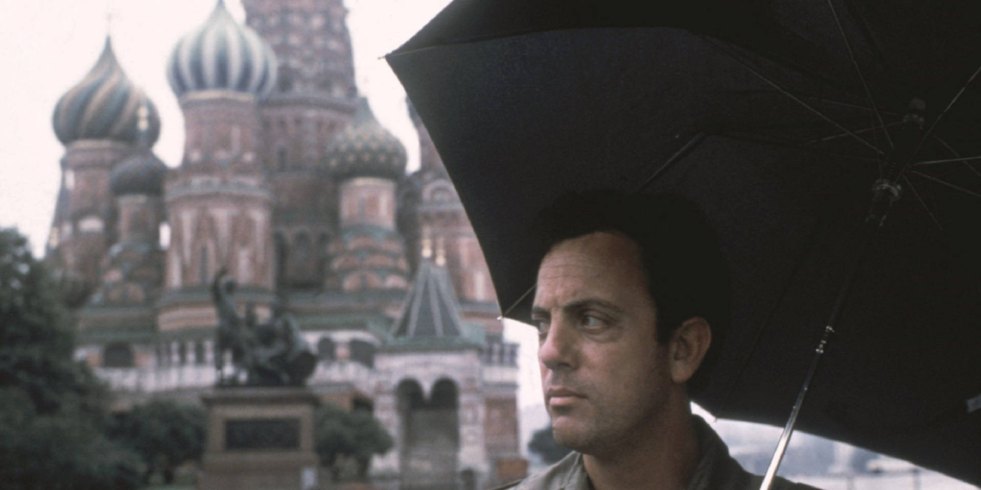 Billy Joel Holding An Umbrella Picture