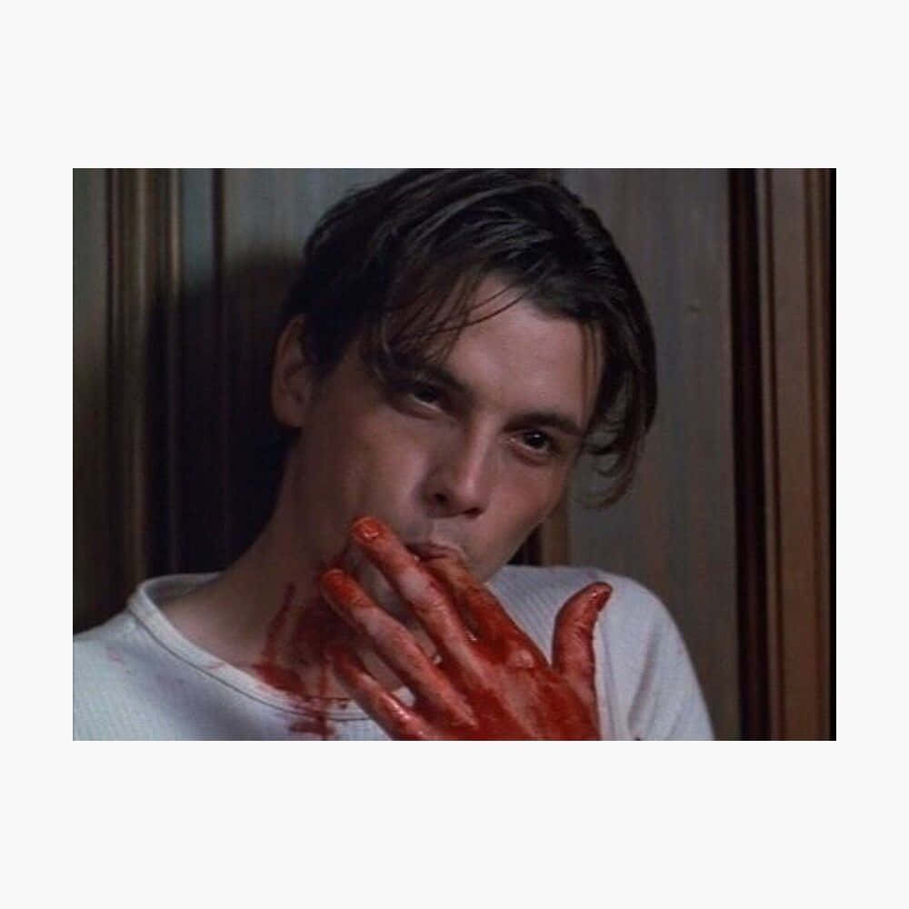 A Man With Blood On His Hands And A Bloody Mouth