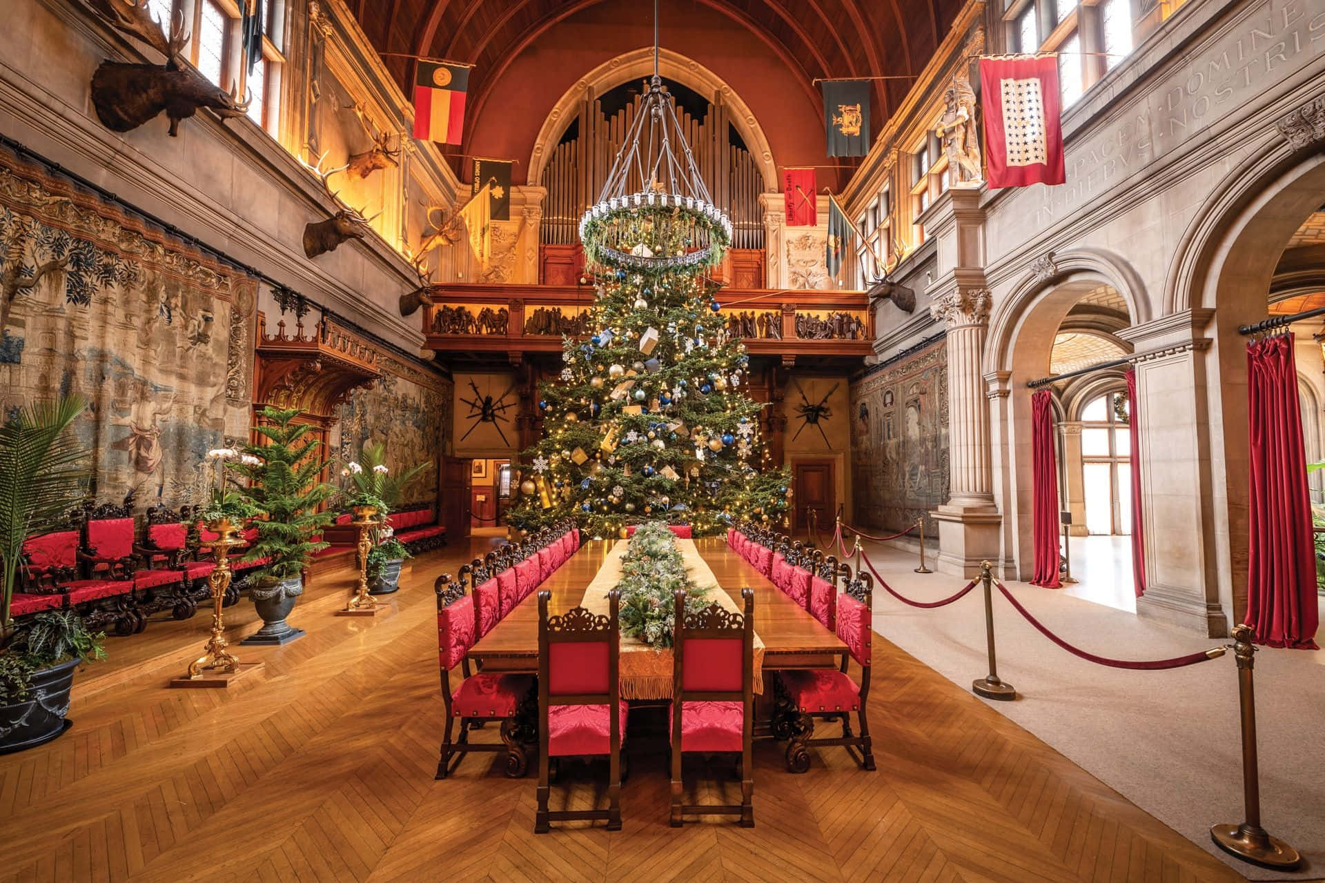 A Large Dining Room With A Christmas Tree