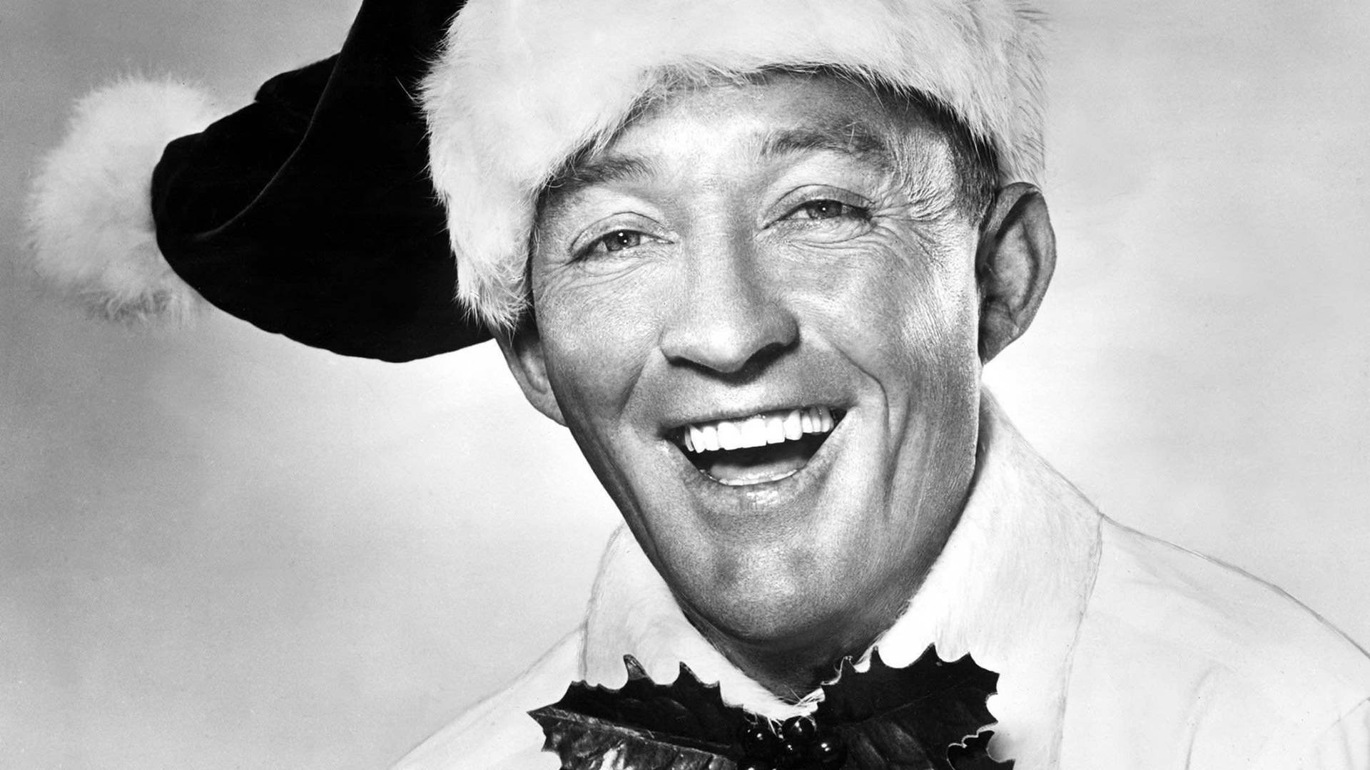 Bing Crosby med julesløjfe tapet Wallpaper