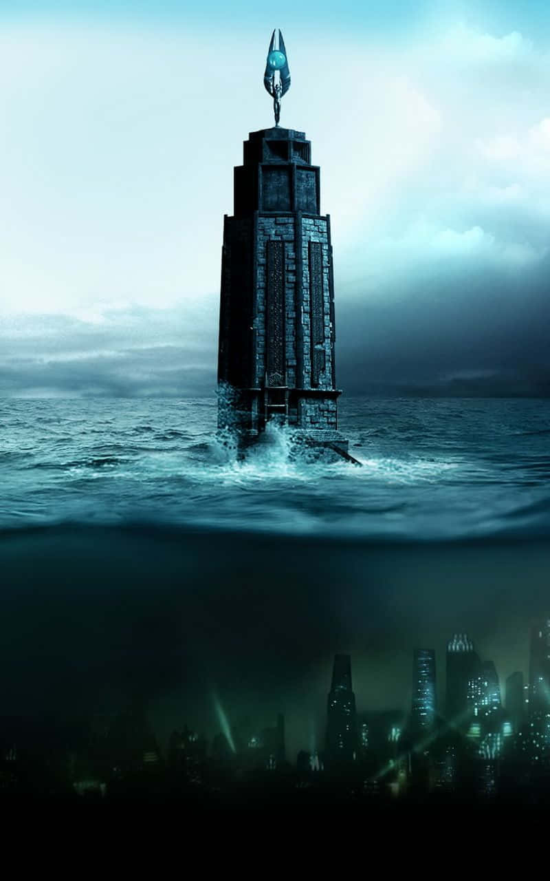A Tower In The Ocean With A City In The Background Wallpaper