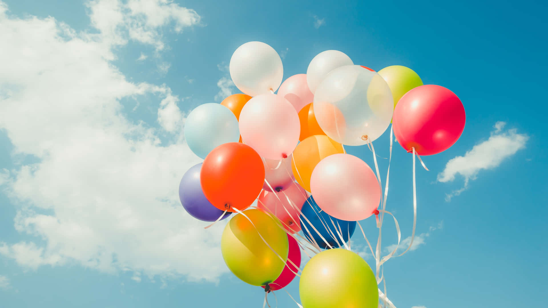 Birthday Balloons Floating In Blue Cloudy Sky Picture