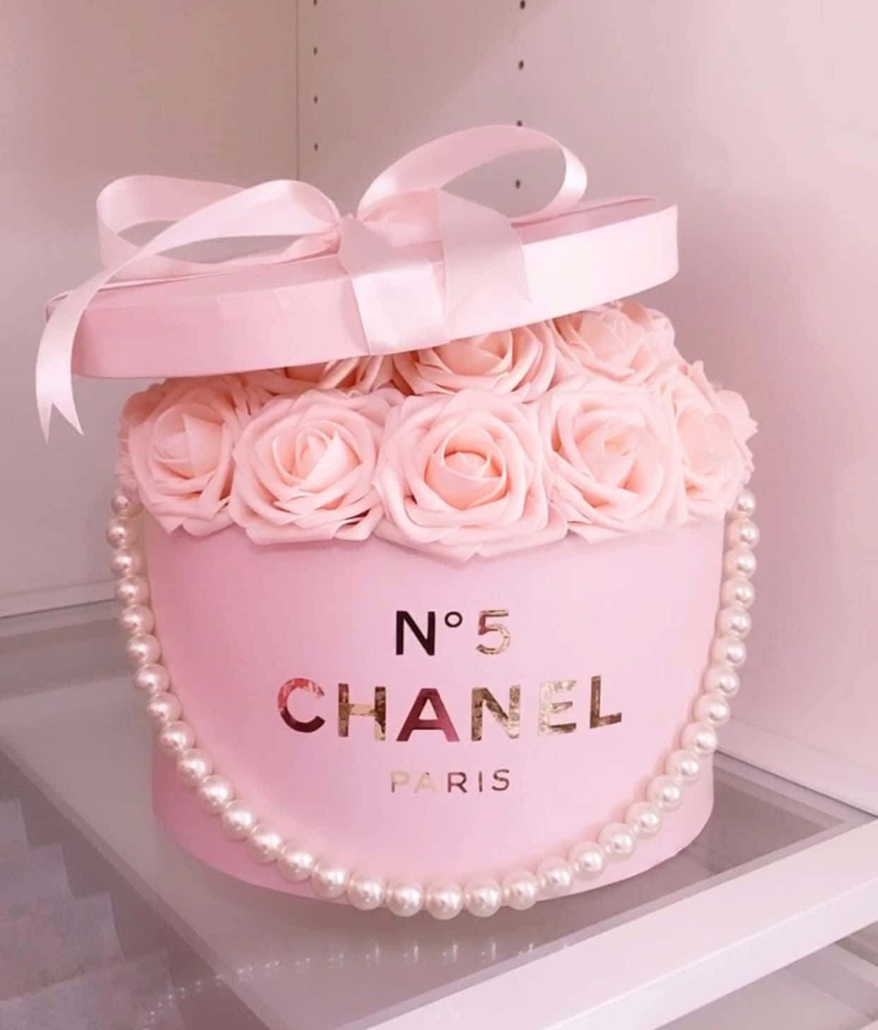 A Pink Box With Roses And Pearls