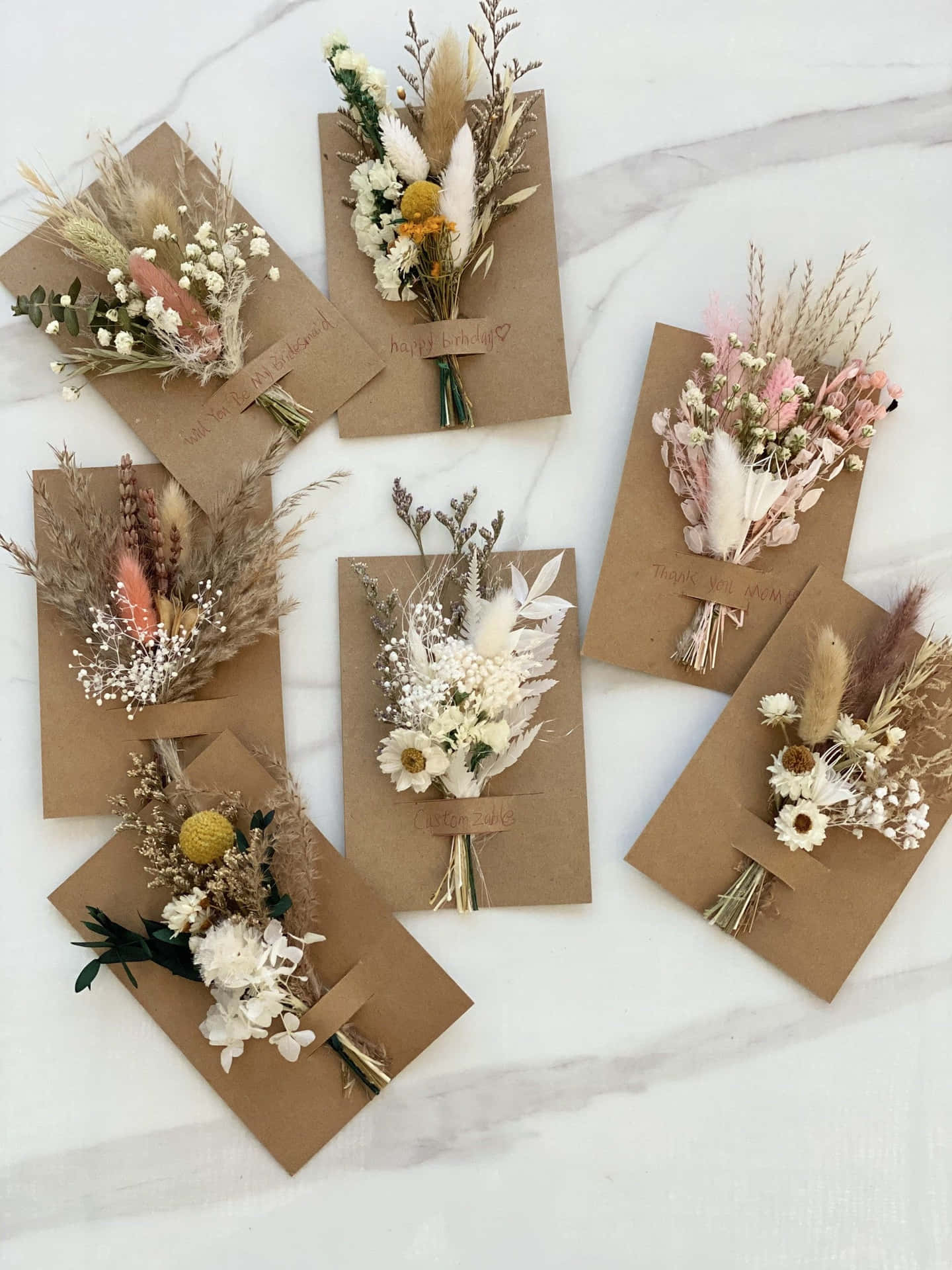 A Bunch Of Dried Flowers In Brown Paper Envelopes