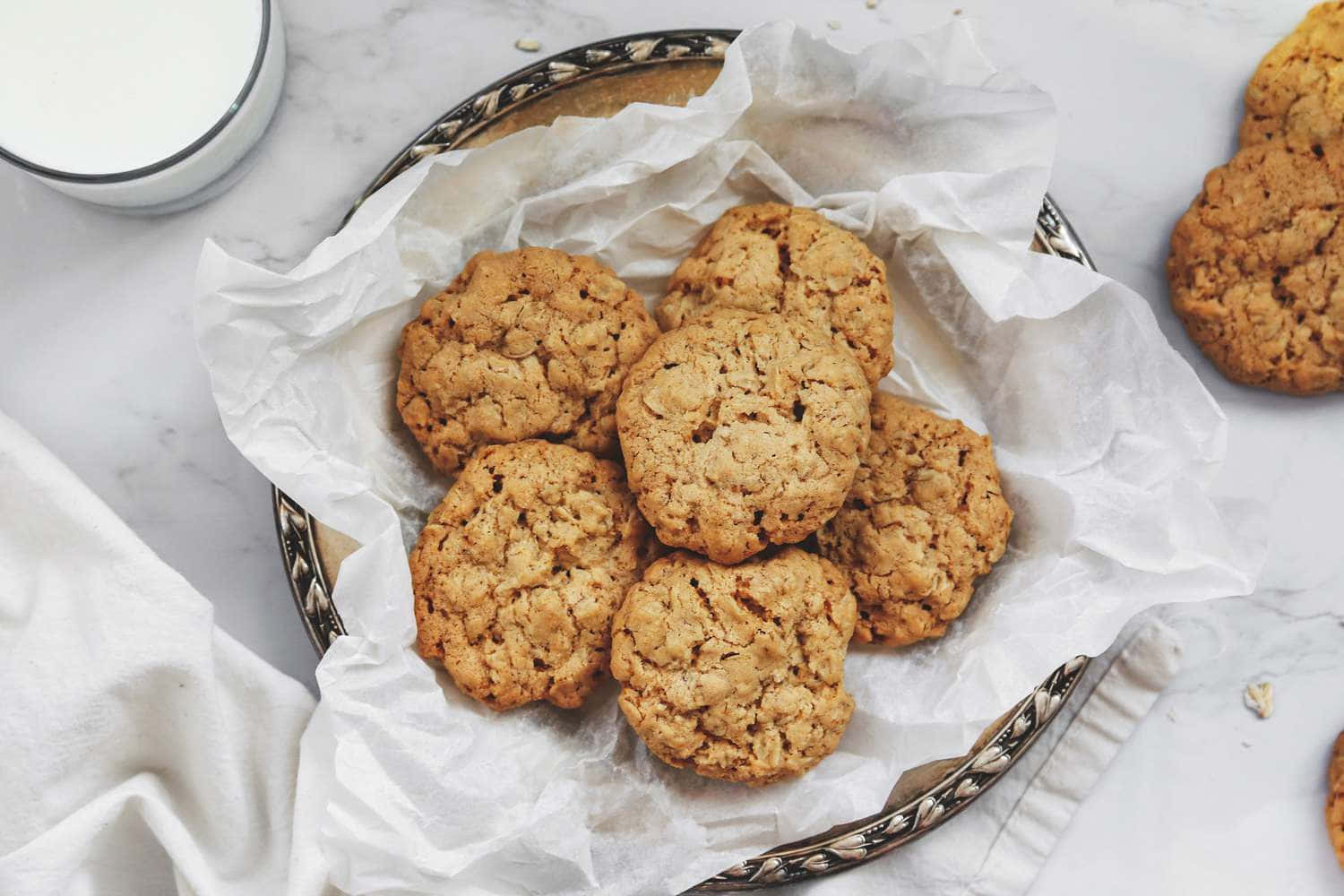 Oatmeal Cookies On A White Plate With Milk
