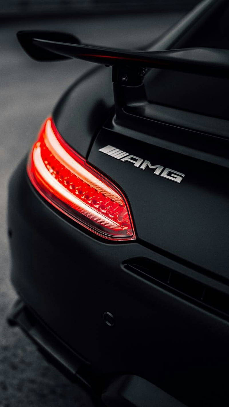 Caption: Black AMG with Glowing Red Tail Lights Wallpaper