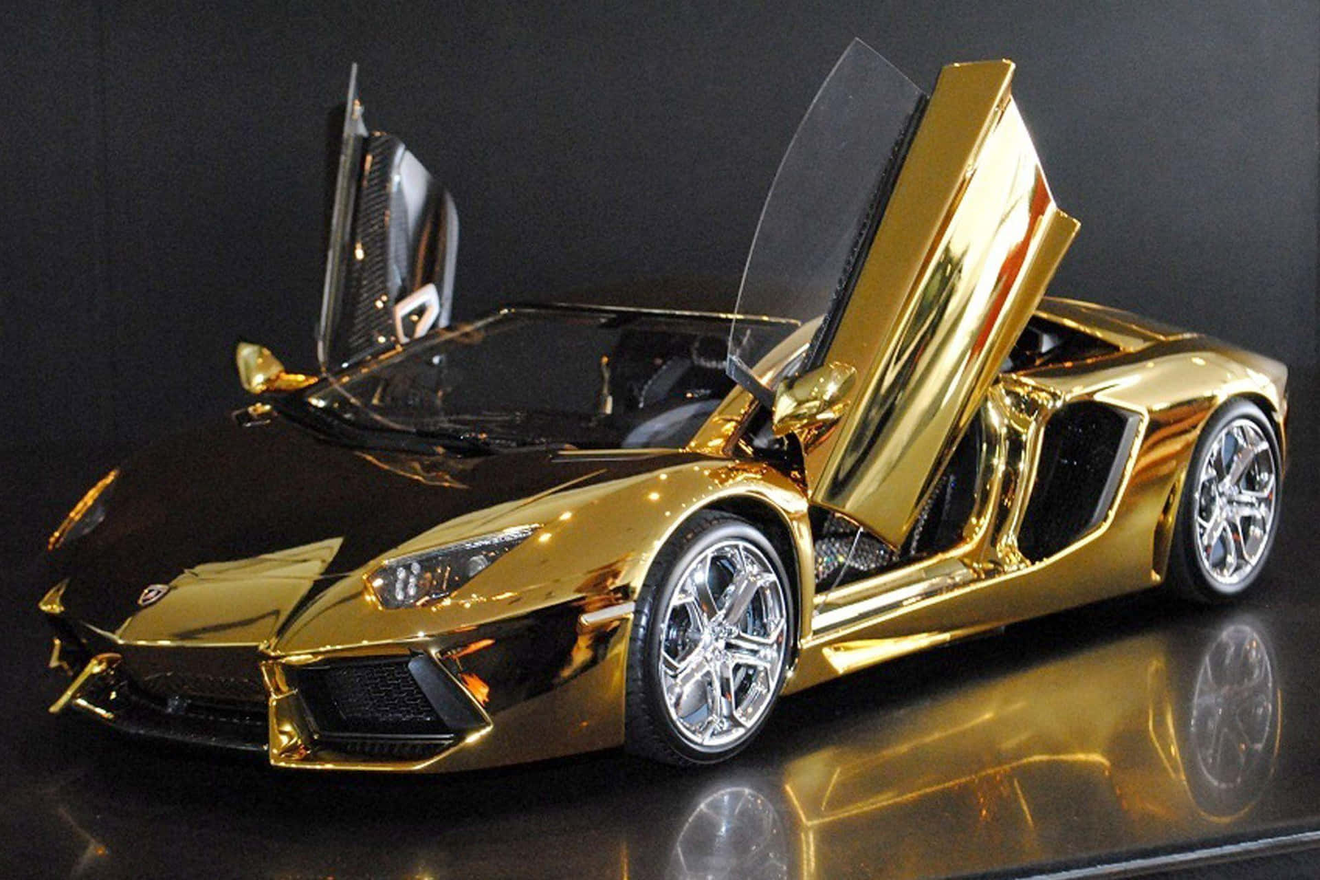 En guldmodel af en Lamborghini sportsvogn Wallpaper