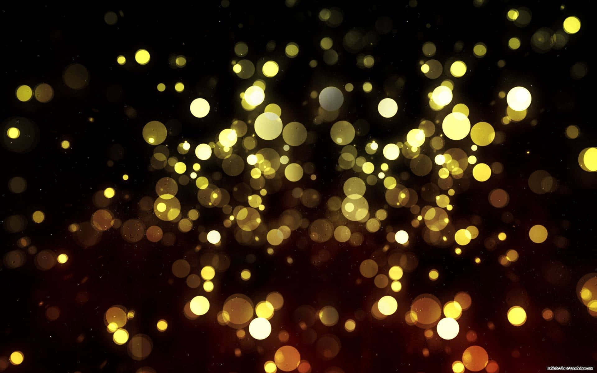A Black Background With Gold Lights And Bokeh Wallpaper
