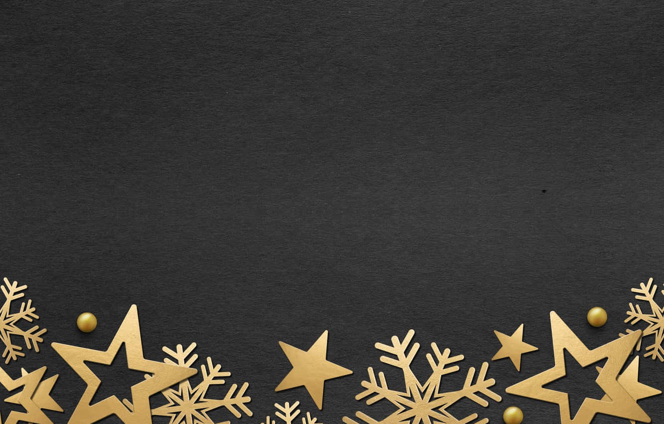 Gold Stars And Snowflakes On A Black Background Wallpaper