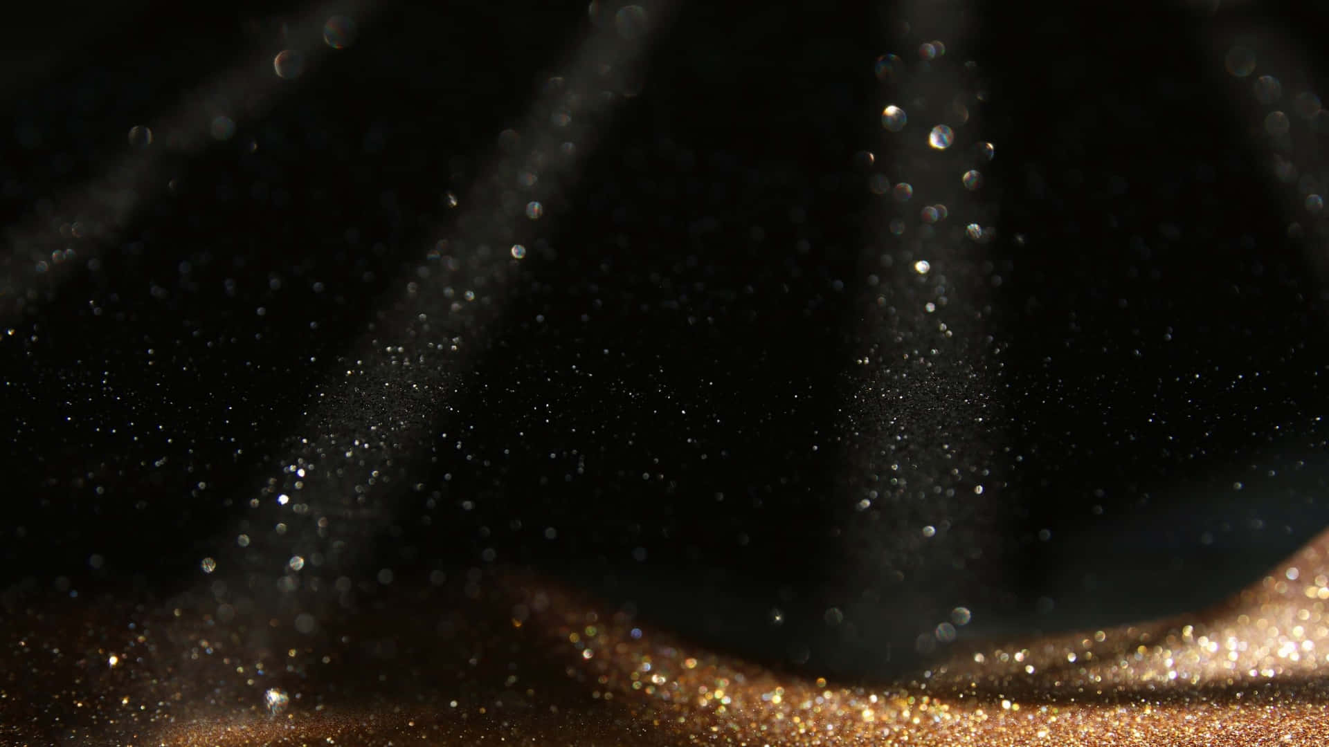Black And Gold Glitter With Spotlights Wallpaper