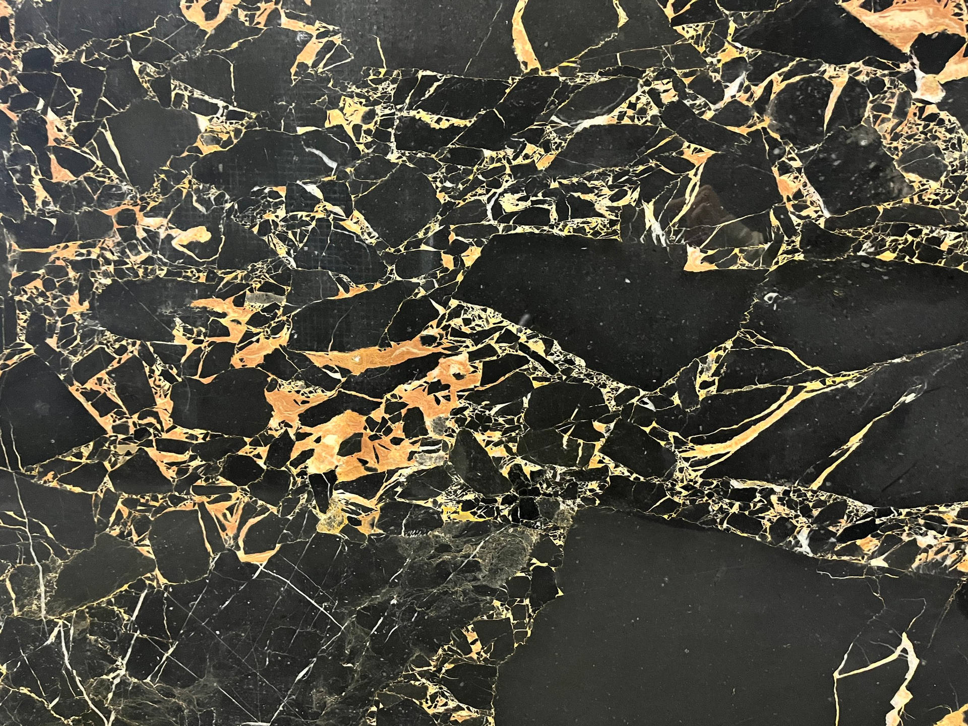 Intriguing Patterns of Black and Gold Marble Wallpaper
