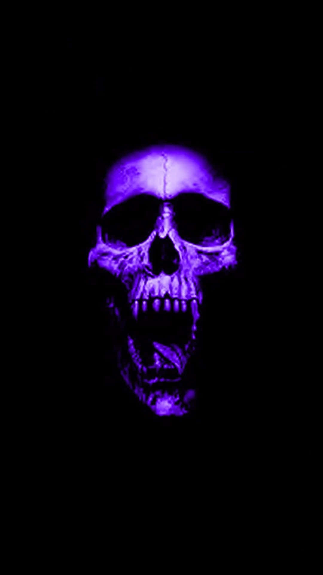 A Purple Skull Is Lit Up In The Dark
