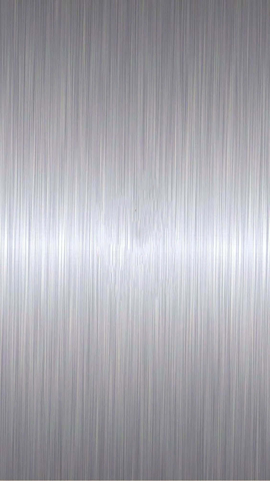 A Silver Metal Background With A Textured Surface Wallpaper