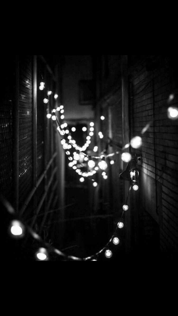 Black And White Aesthetic Christmas Lights In Alley Wallpaper