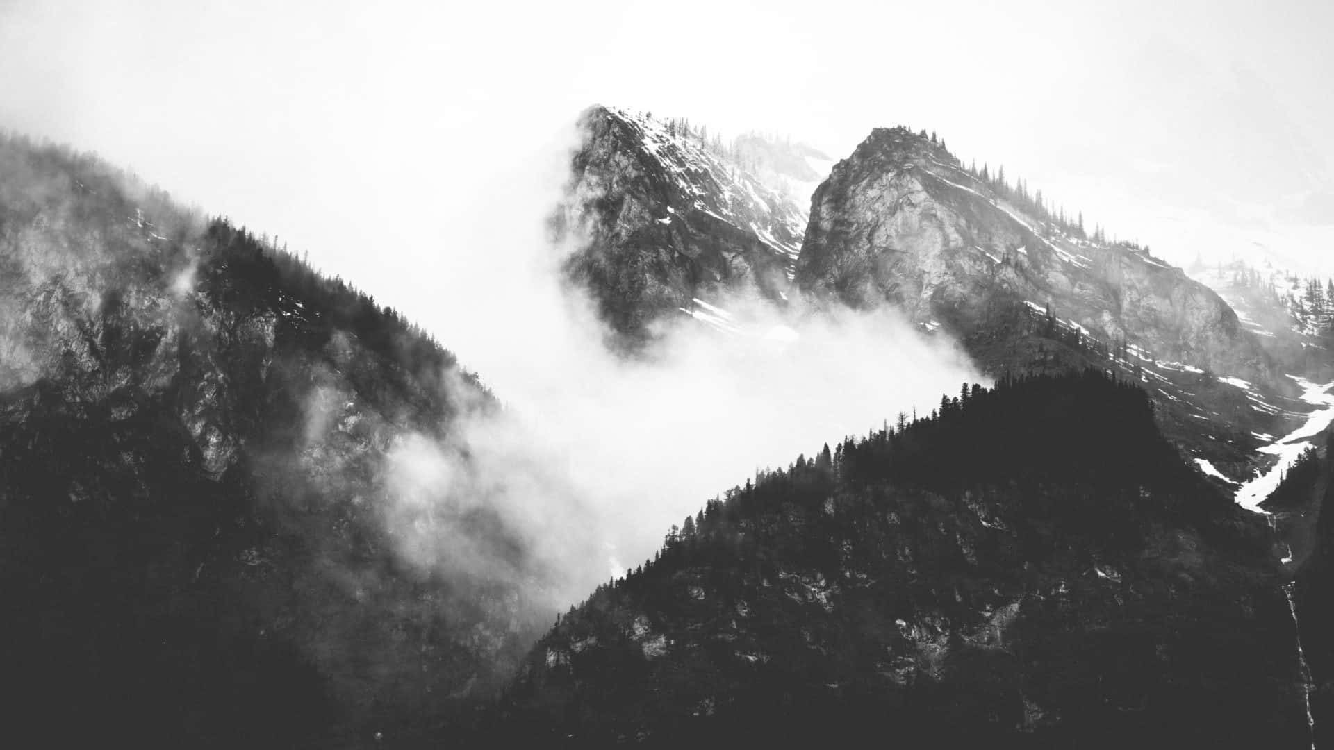 Black And White Photo Of Mountains With Clouds Wallpaper