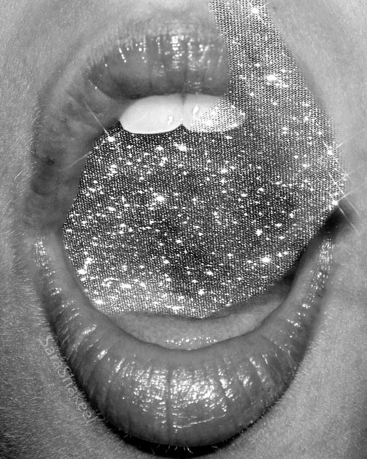 A Woman's Mouth With Silver Glitter On It