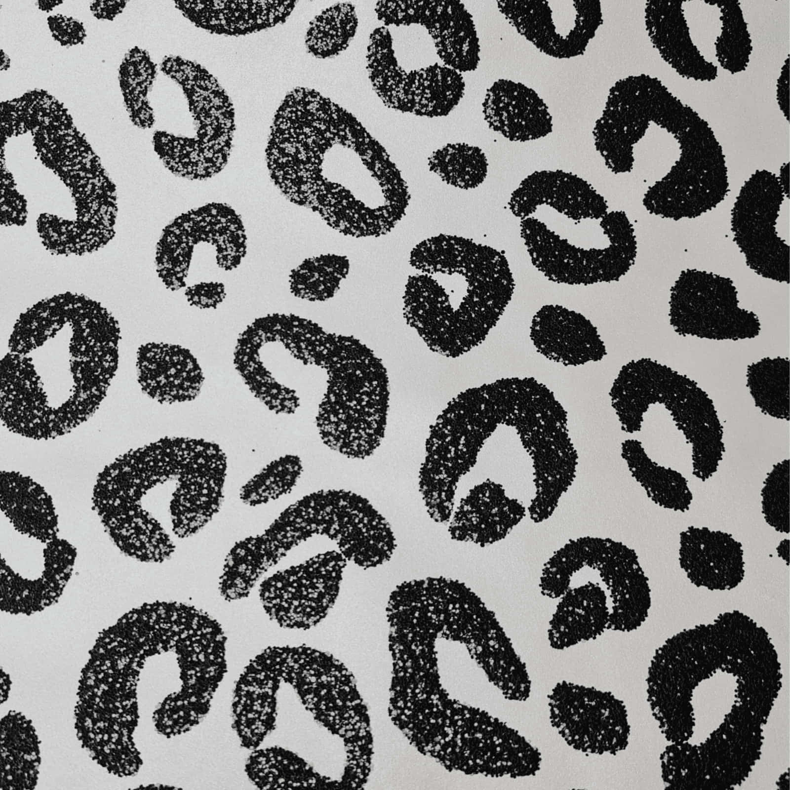 A Black And White Leopard Print Fabric Wallpaper