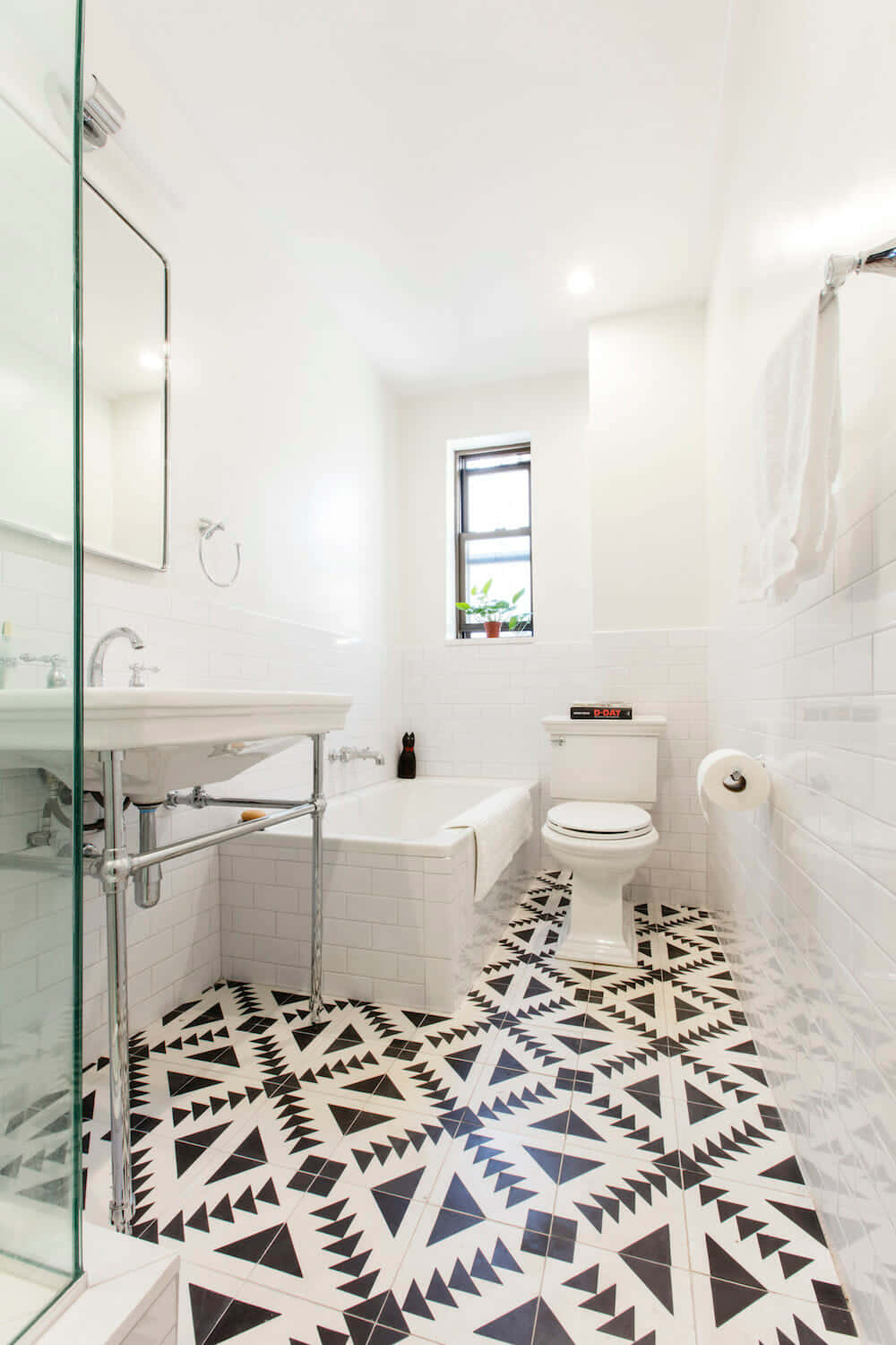 Elegant black and white bathroom with modern tile accents