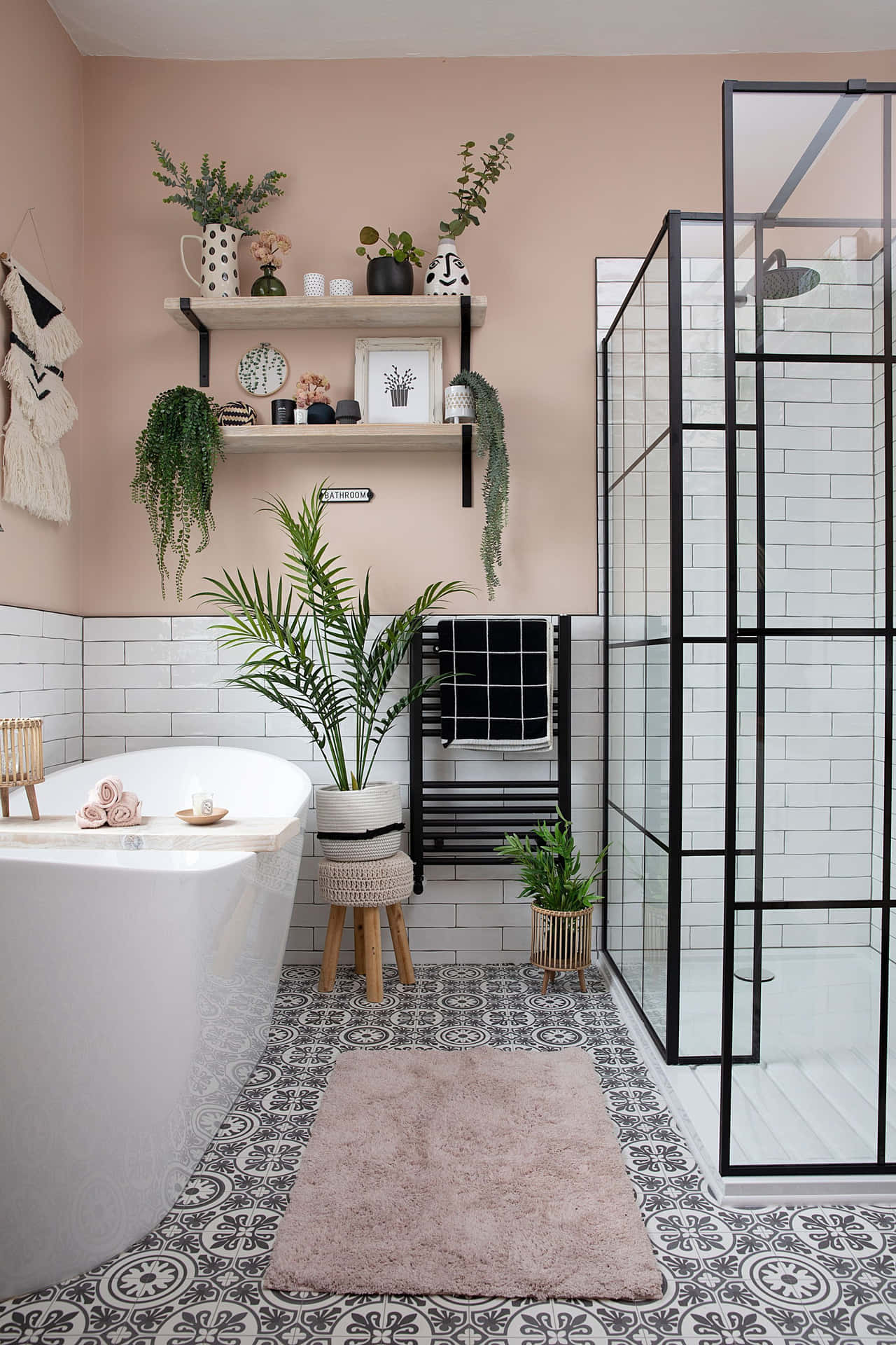 A Bathroom With A Black Shower And White Walls