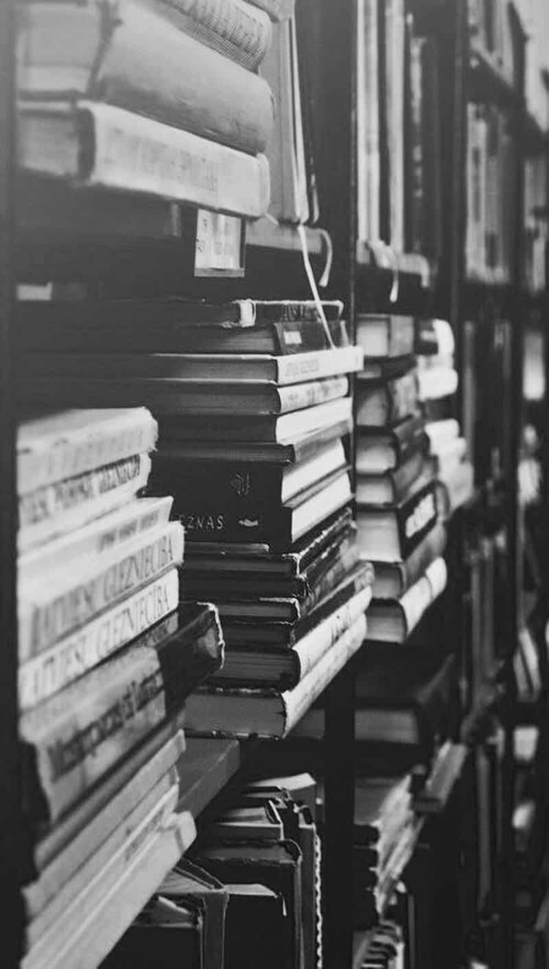 A black and white image of an open book Wallpaper
