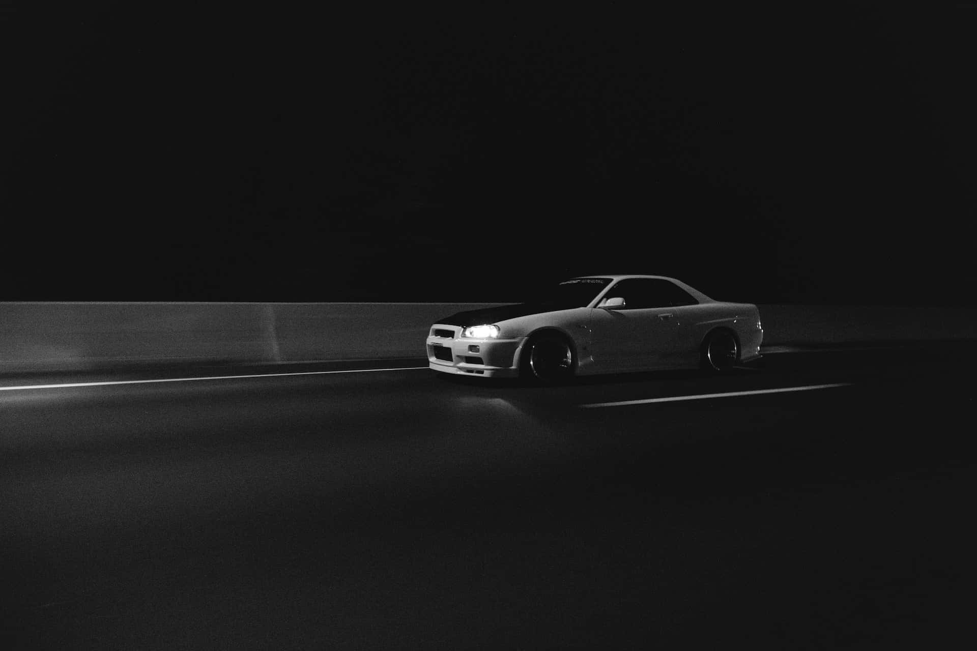 Classic Black and White Car on the Road Wallpaper