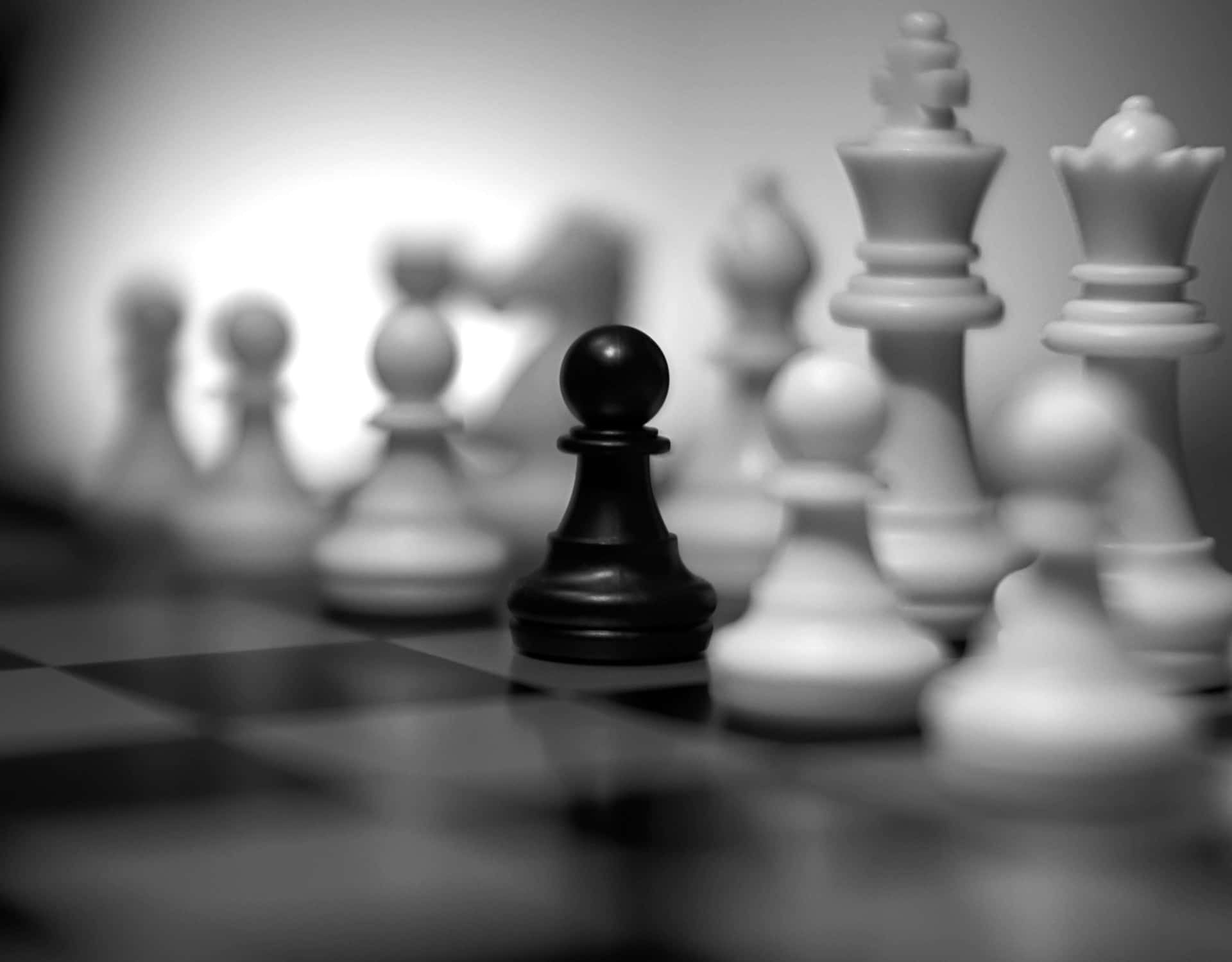 Black and White Chess Pieces on a Chessboard Wallpaper