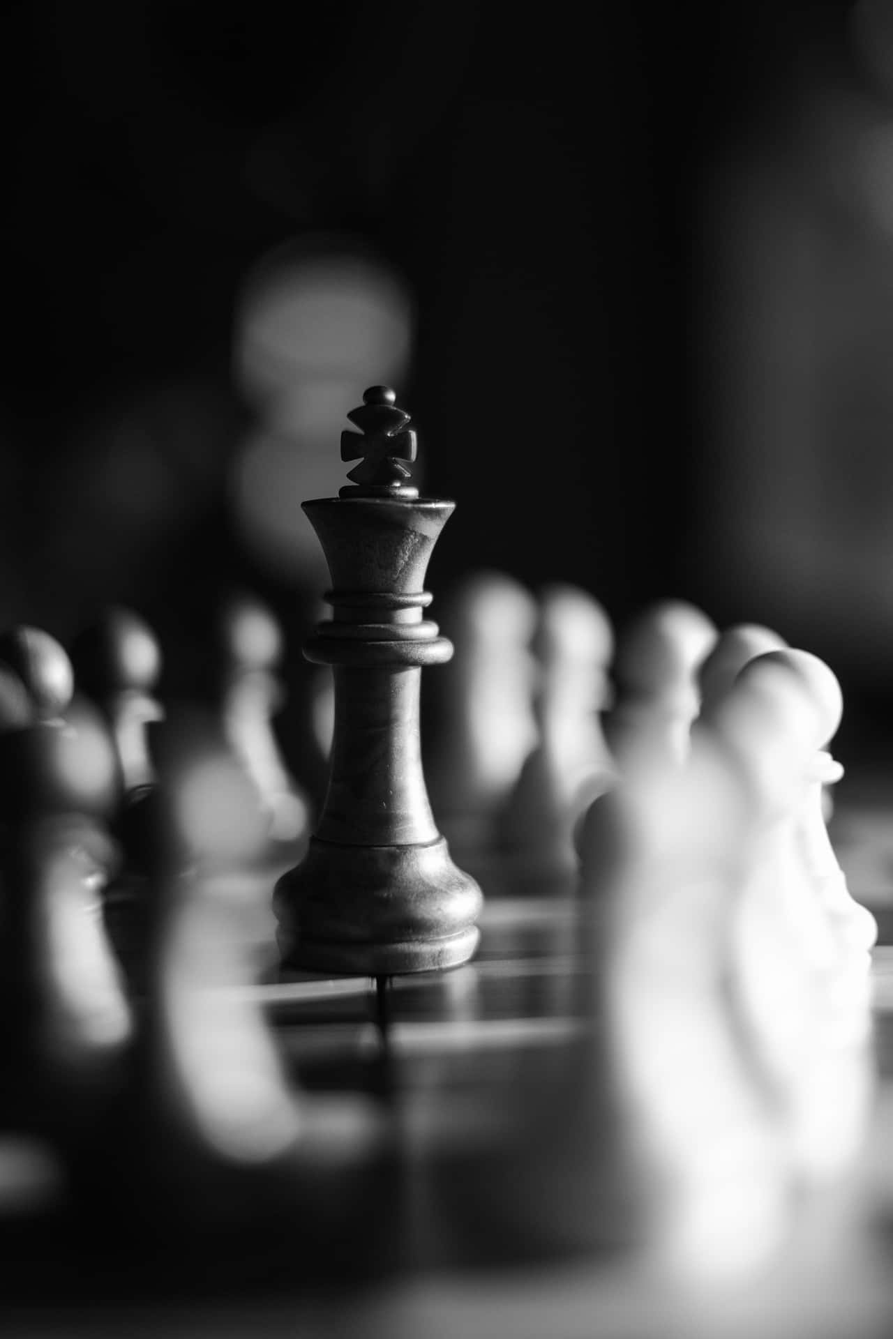 Black and White Chess Battle on the Board Wallpaper