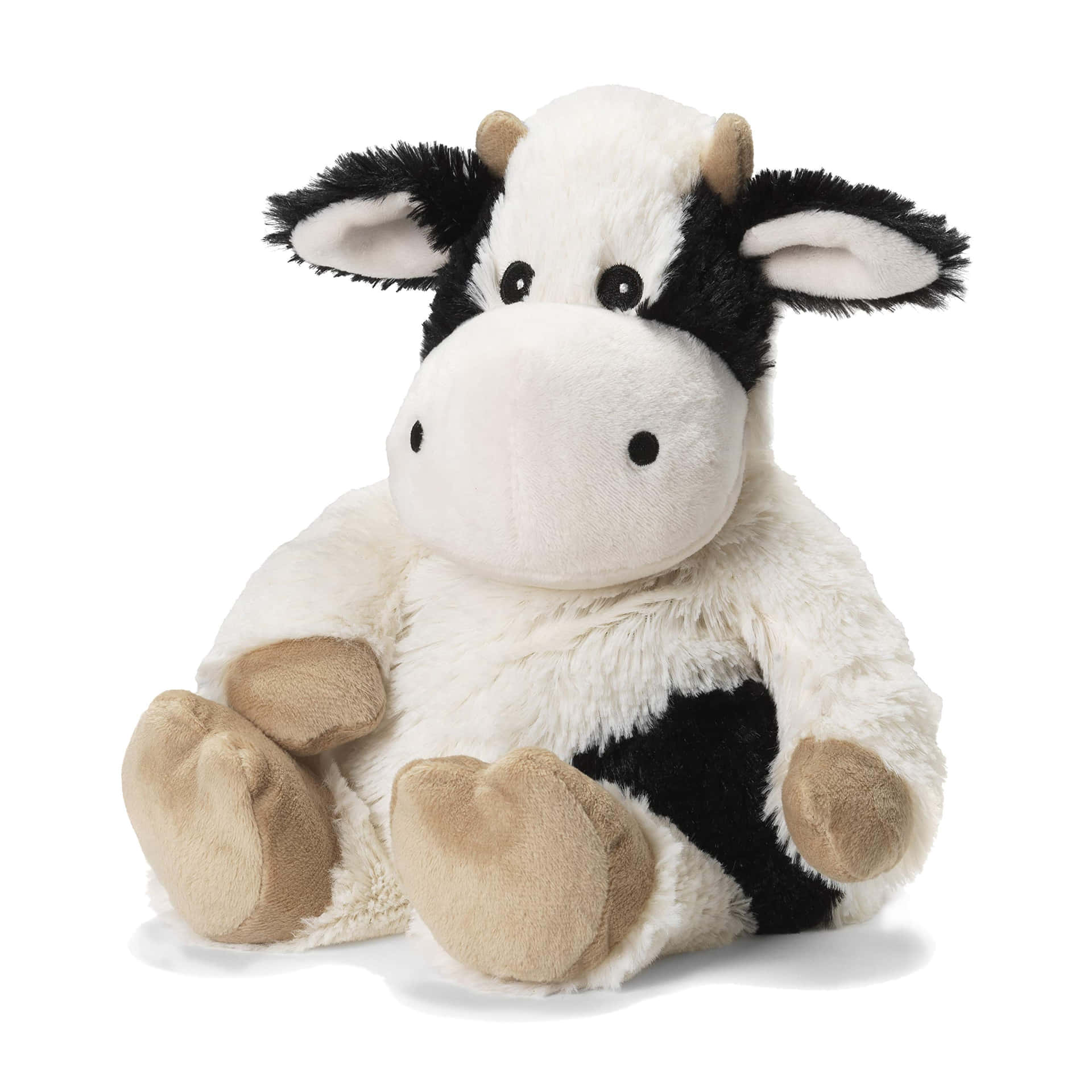 A Stuffed Cow Sitting On A White Background