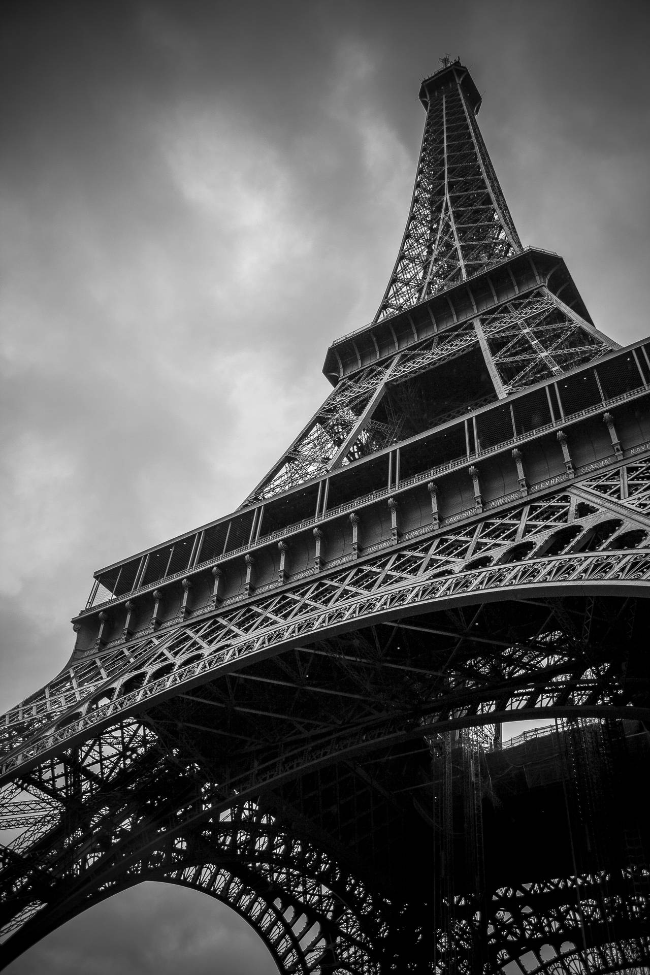 Cool wallpaper of low angle black and white Eiffel Tower in Paris.
