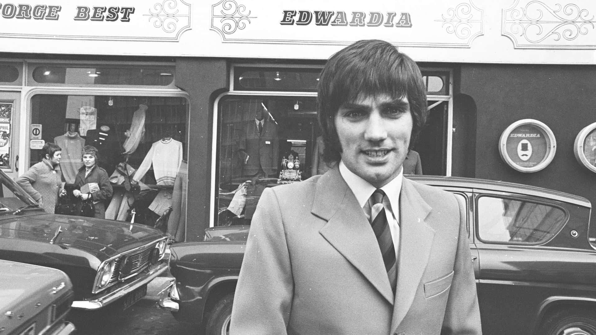Black And White George Best In His Boutique Wallpaper