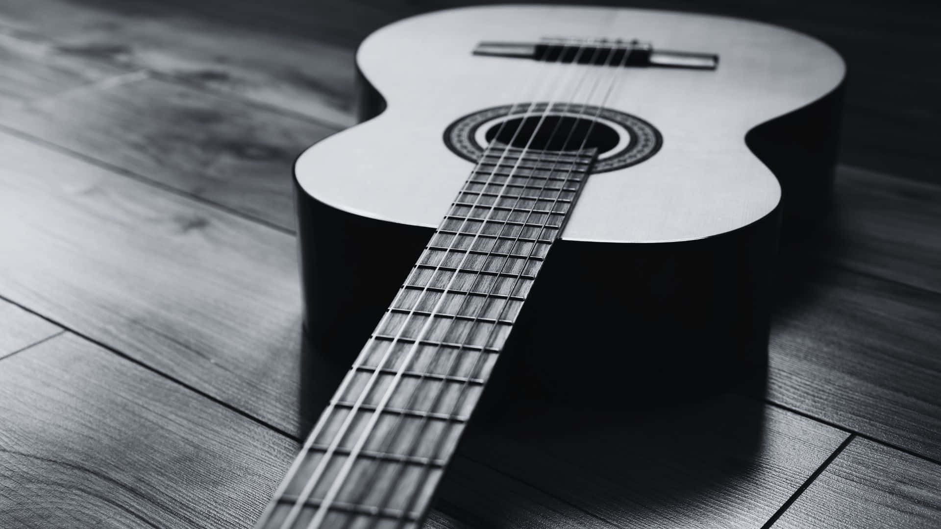 Stunning Black and White Guitar in Close-up View Wallpaper
