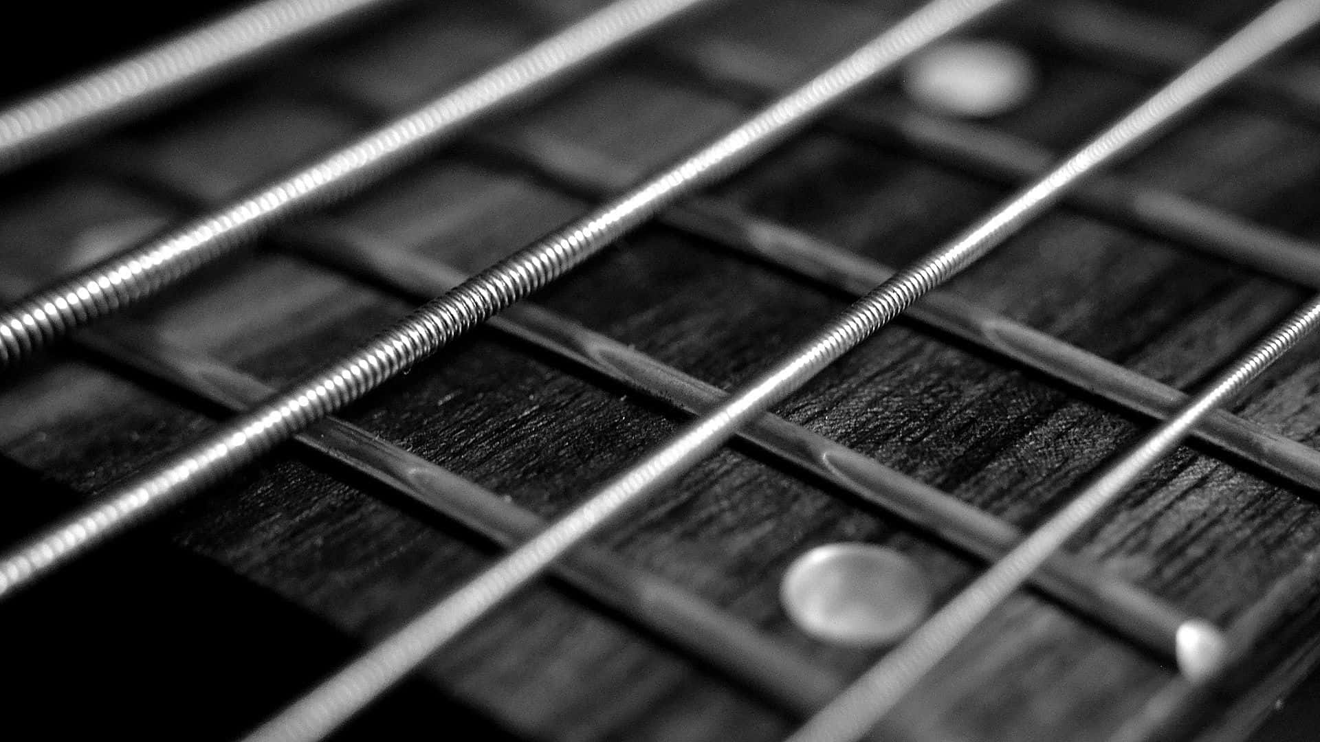 A captivating black and white guitar Wallpaper