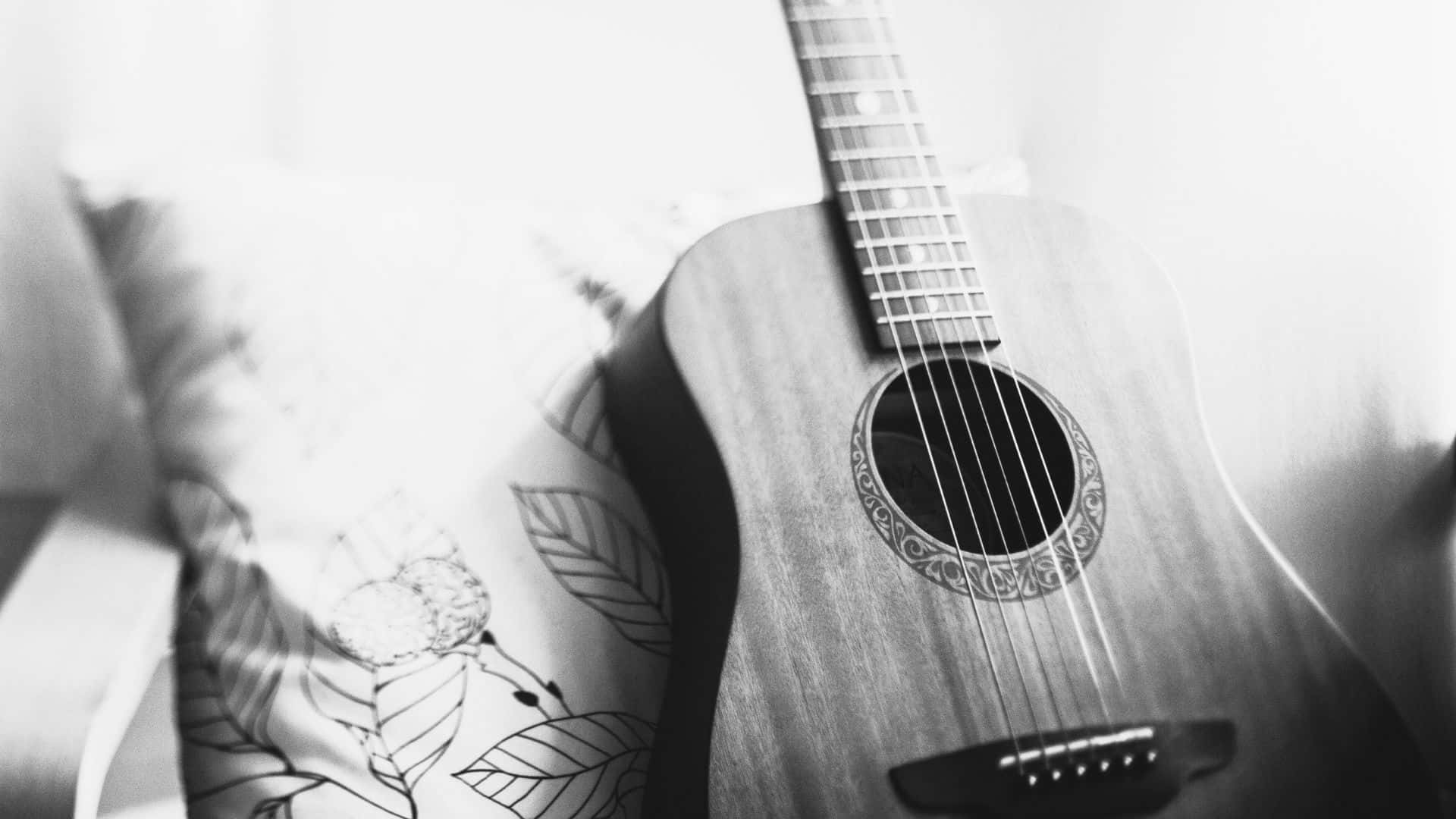Elencanto Monocromático: La Belleza De Una Guitarra En Blanco Y Negro. Fondo de pantalla