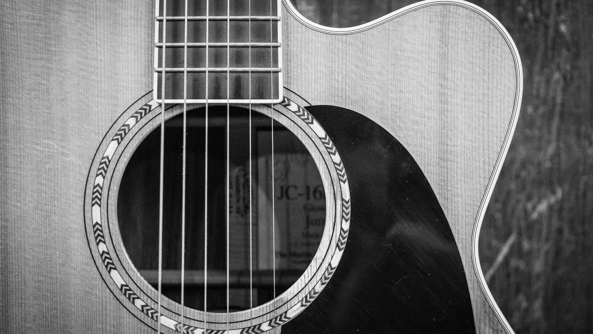 Imagenimpactante De Una Guitarra En Blanco Y Negro. Fondo de pantalla