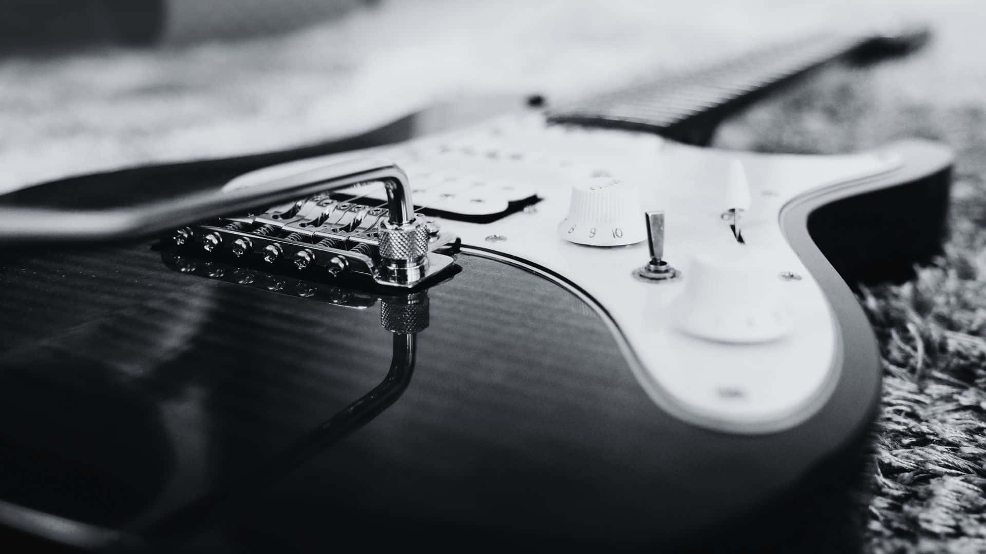 Download Caption: Black and White Guitar Wallpaper | Wallpapers.com