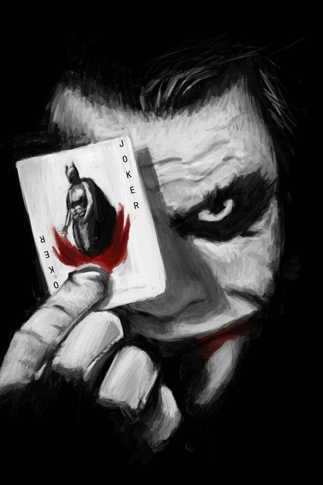 Black And White Joker Holding Up A Card Wallpaper