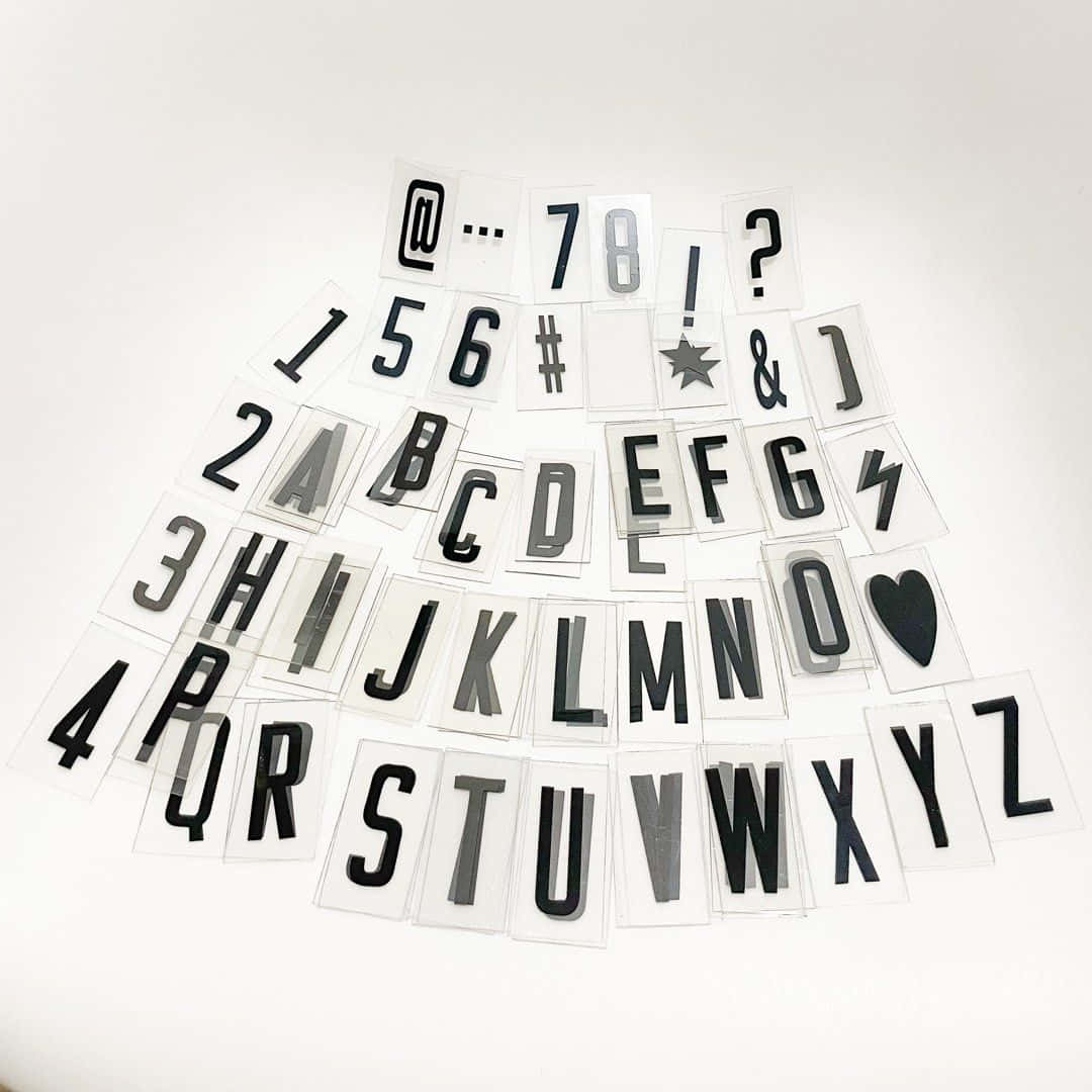 Black and white typography art featuring a letter Wallpaper
