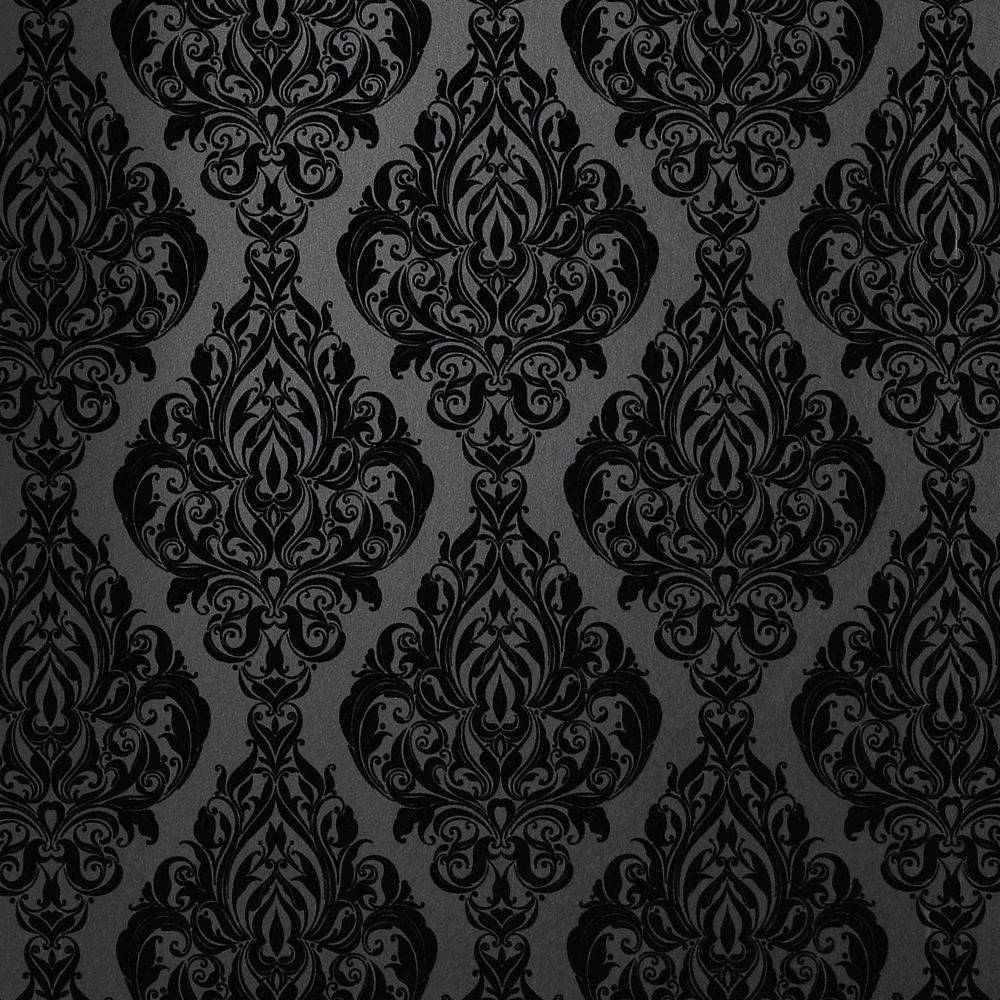 Intricate mandala wall pattern design with leaves forming string of diamonds in black and white.  