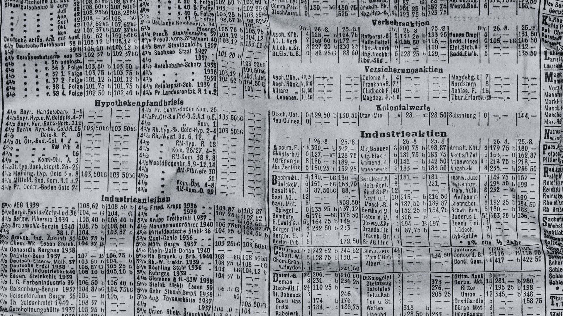 An open broadsheet newspaper showing black and white print Wallpaper