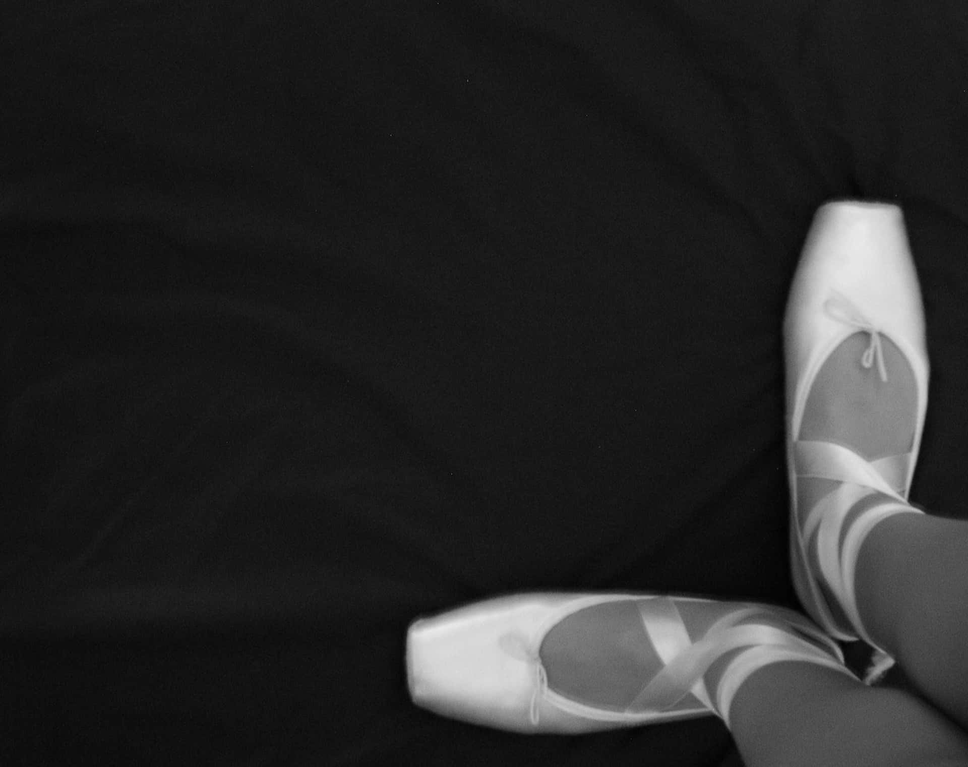 Dancing through Monochrome: Black and White Pointe Ballet Shoes Wallpaper