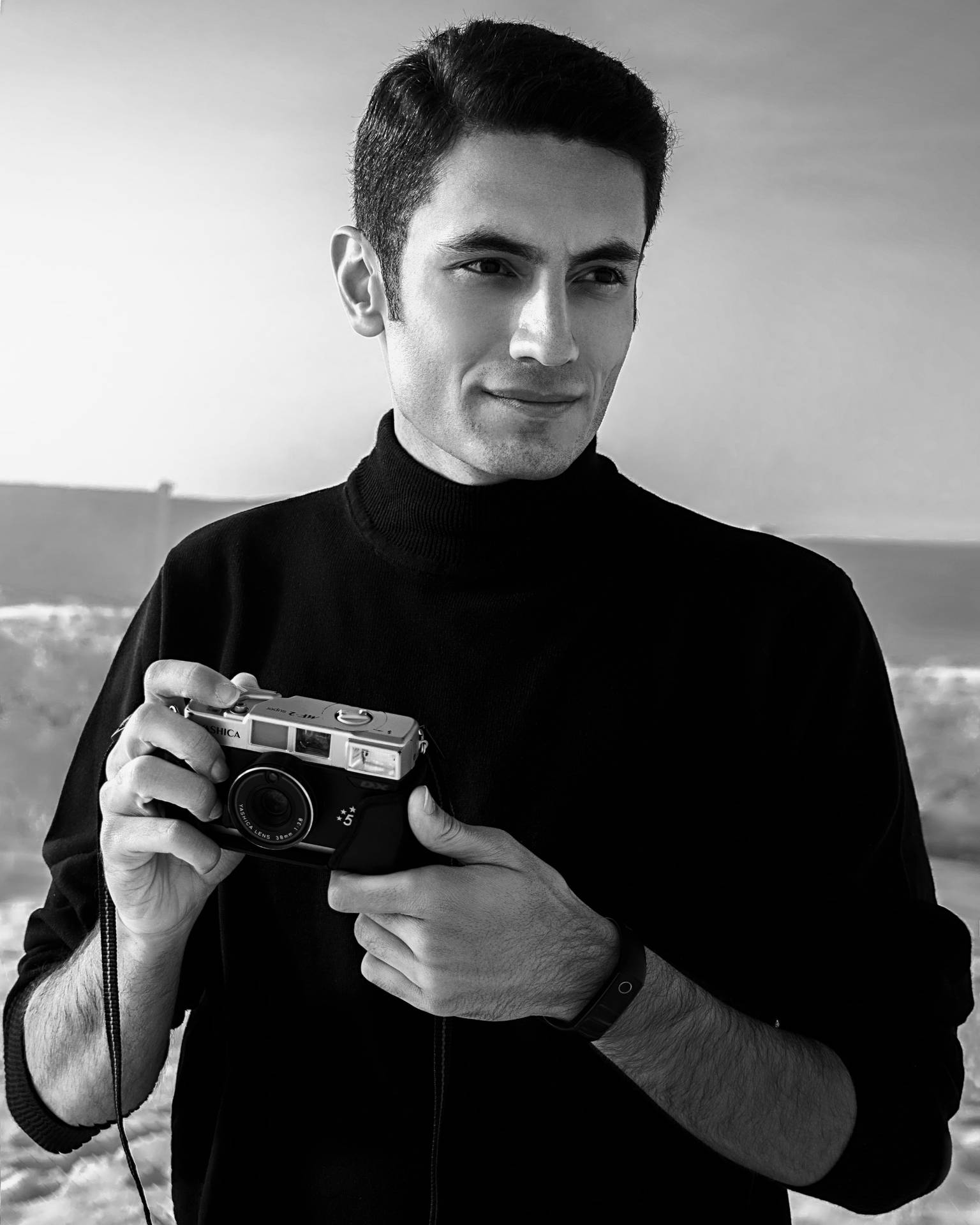 Black And White Portrait Of A Man With A Camera Wallpaper