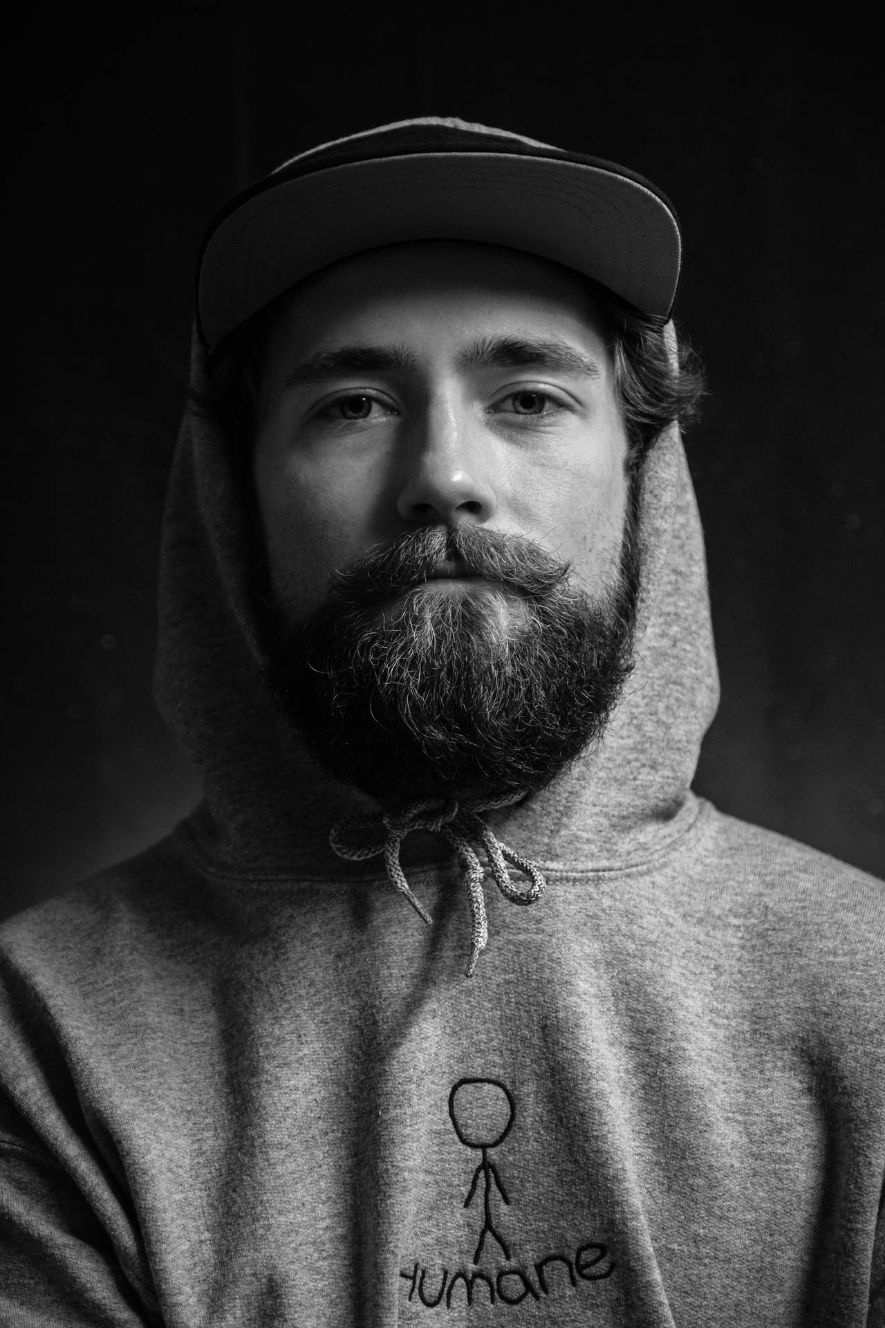 Black And White Portrait Of A Man With A Hoodie Wallpaper