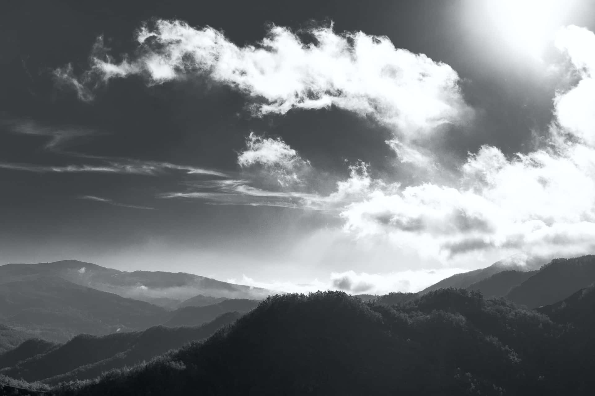 Caption: Dramatic Black and White Sky Wallpaper