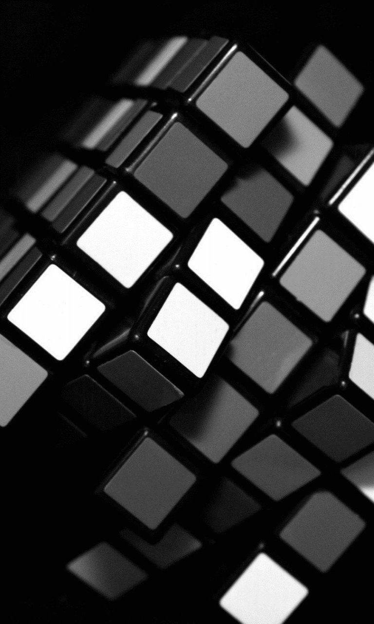 Cuadrode Ajedrez Negro Y Blanco En El Cubo De Rubik Fondo de pantalla