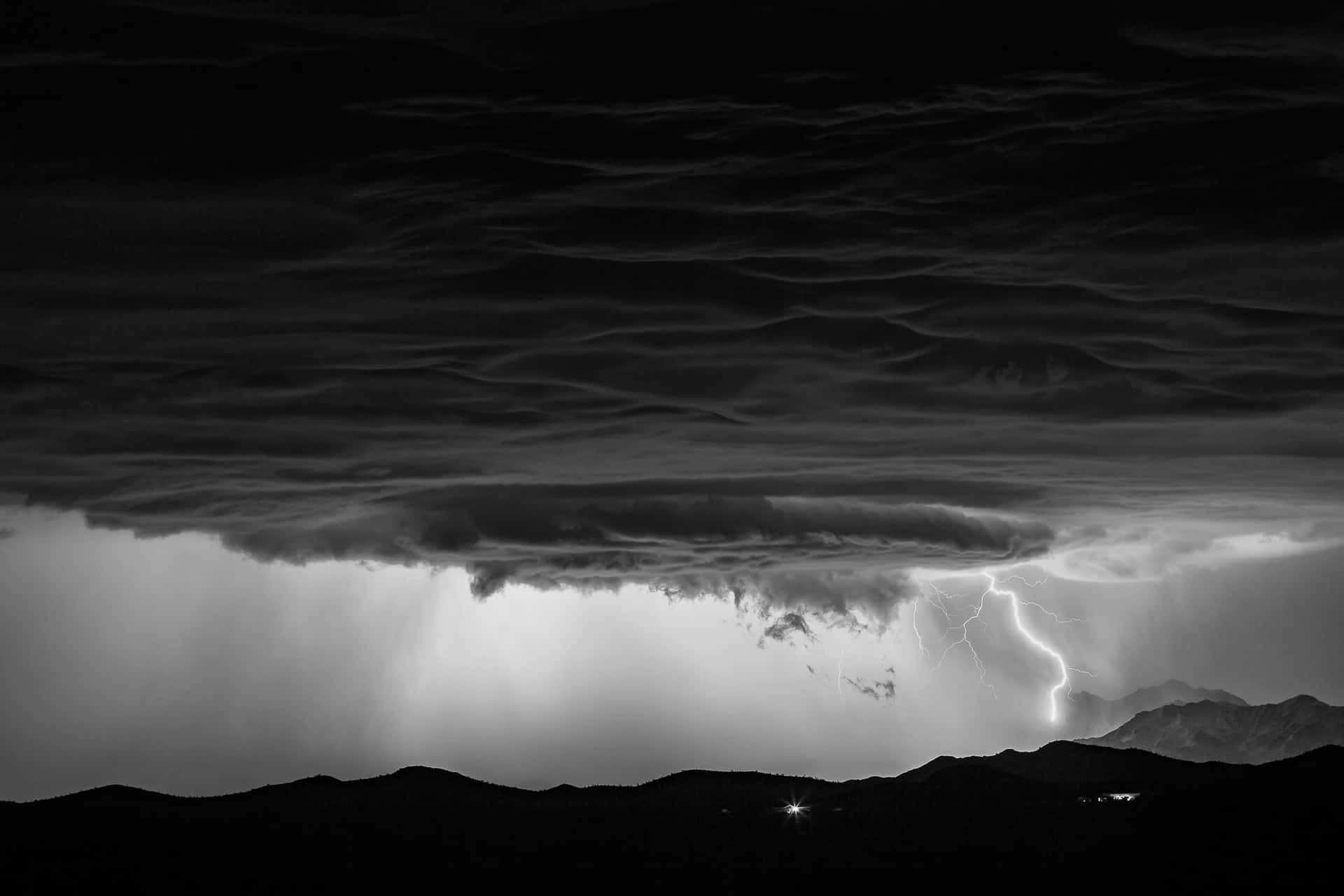 Dramatic Black and White Storm Clouds Wallpaper